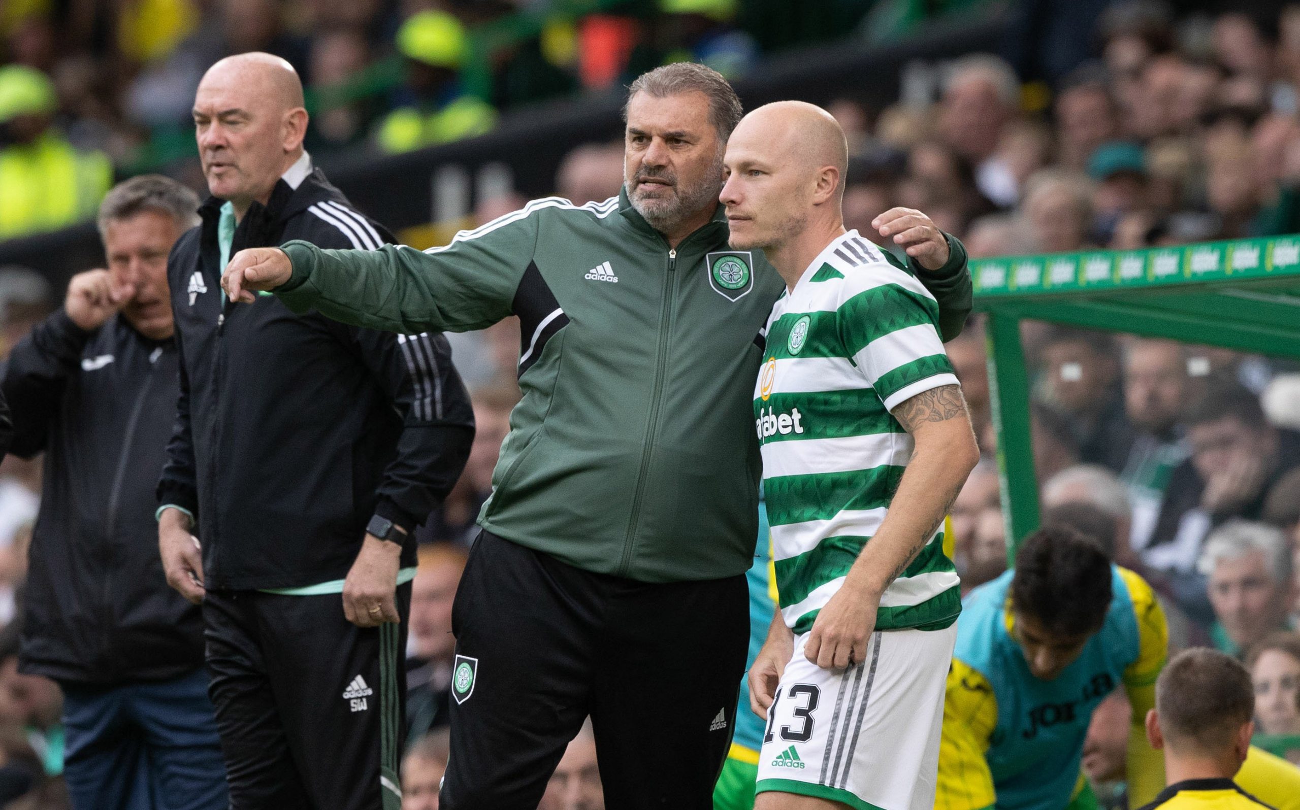 Celtic manager Ange Postecoglou speaks to Aaron Mooy.