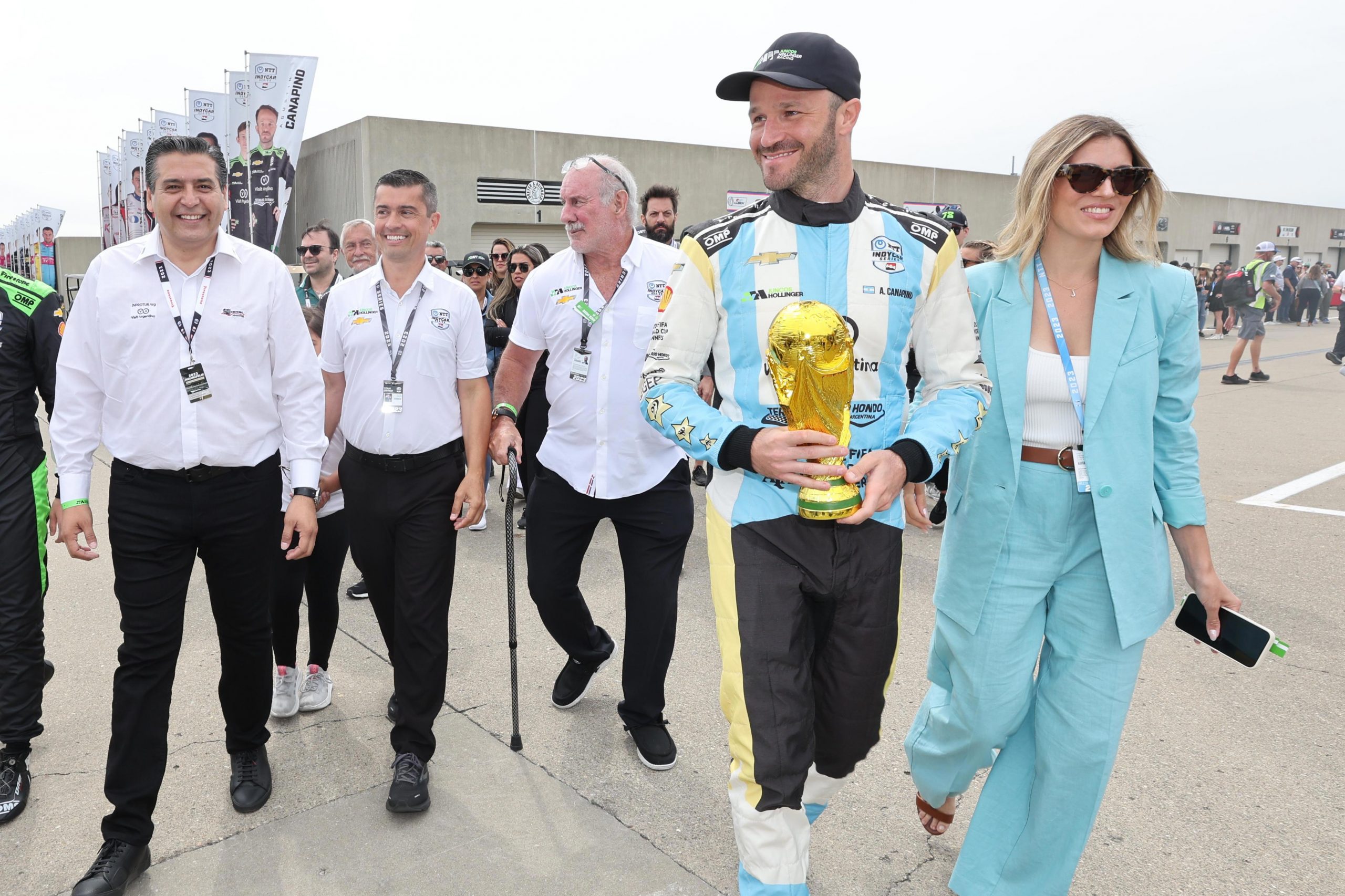 Agustin Canapino brings the FIFA World Cup trophy onto the Indianapolis 500 grid.