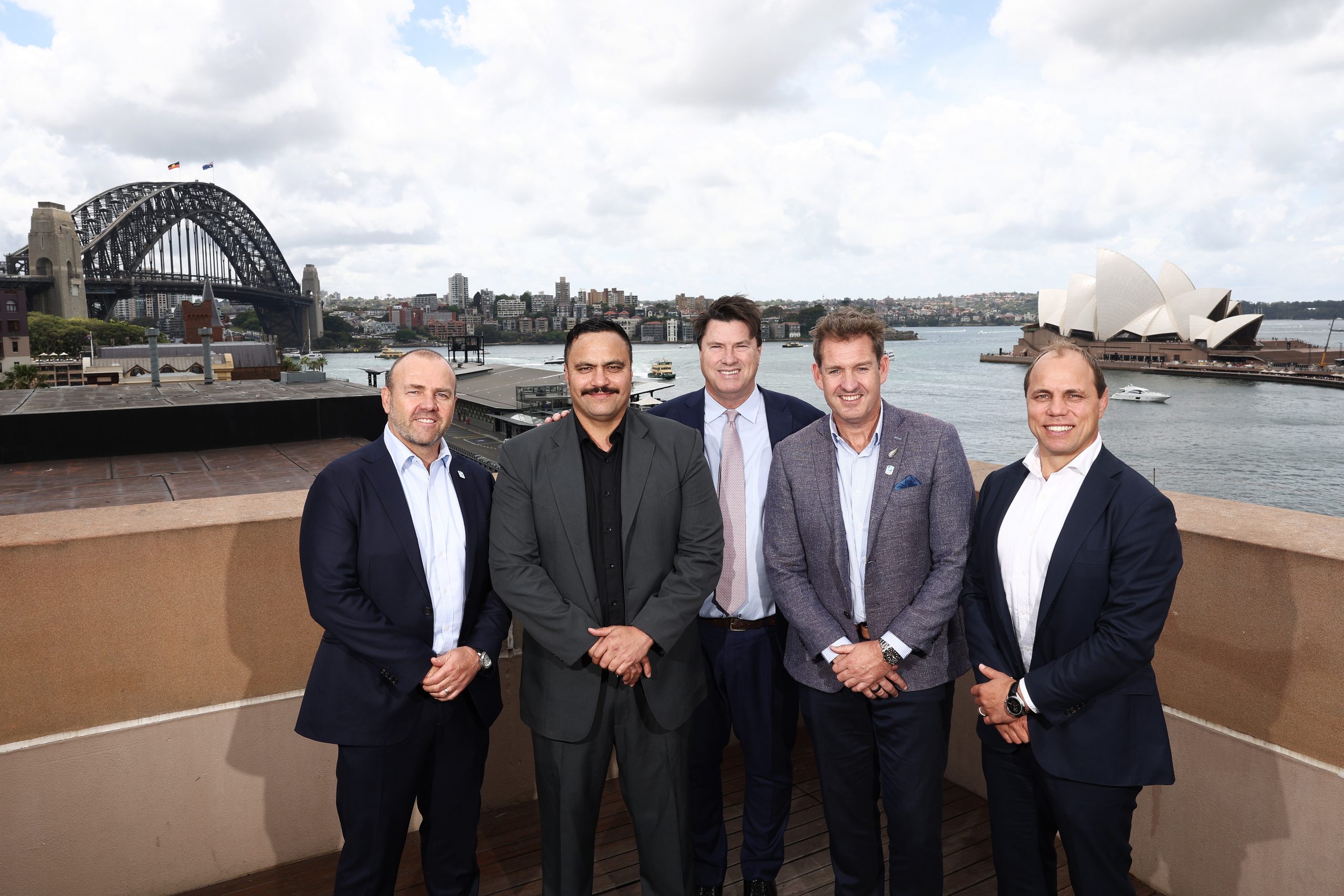 (left to right) Rugby Australia CEO Andy Marinos, Bailey Mackey, Rugby Australia Chairman Hamish McLennan, New Zealand Rugby CEO Mark Robinson and former Wallabies player Phil Waugh.