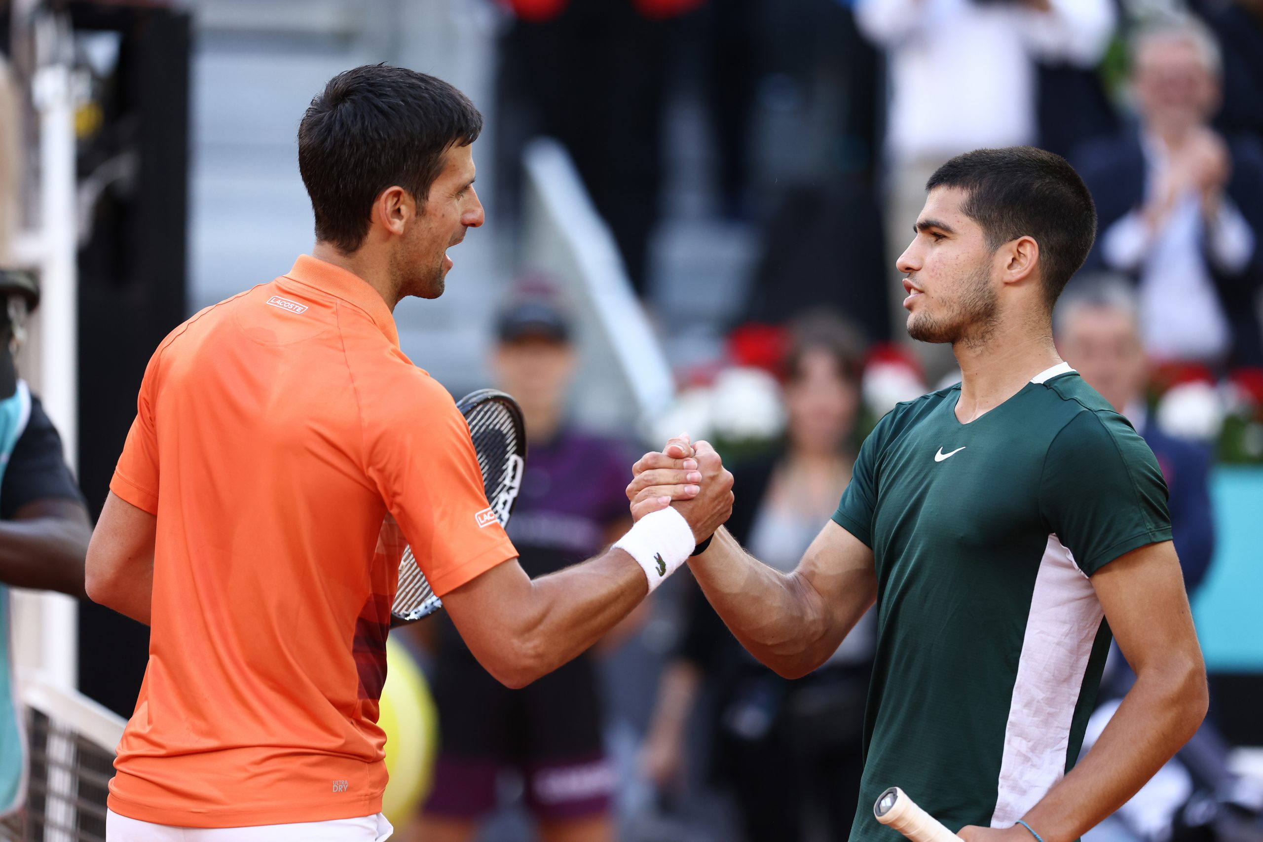 Carlos Alcaraz of Spain greets Novak Djokovic of Serbia.