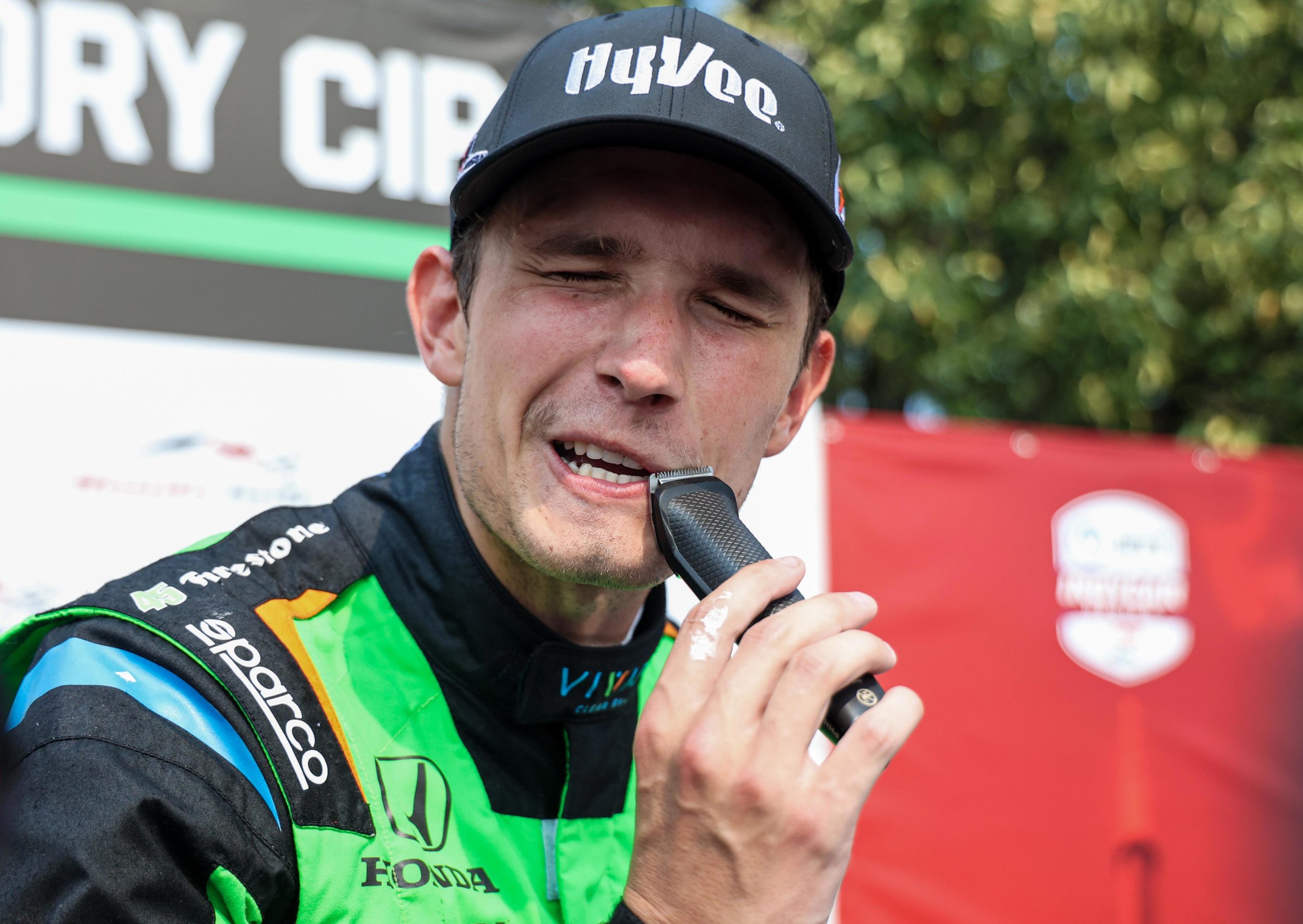 Christian Lungaard shaves his moustache after winning his first IndyCar race, ending a wager with his best friend.