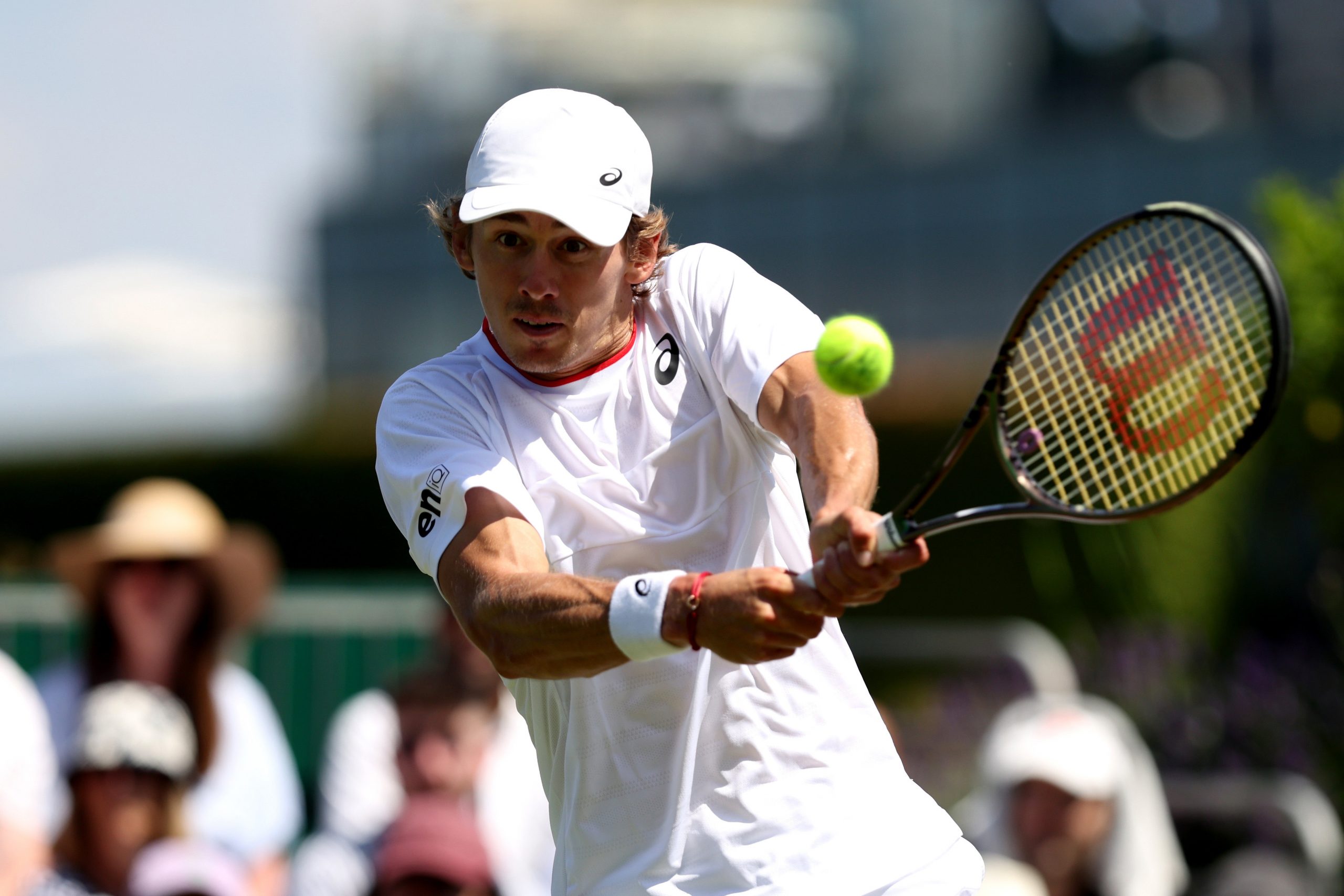 Alex De Minaur of Australia plays a backhand against Matteo Berrettini of Italy in the Men's Singles second round match during day five of The Championships Wimbledon 2023 at All England Lawn Tennis and Croquet Club on July 07, 2023 in London, England. (Photo by Clive Brunskill/Getty Images)