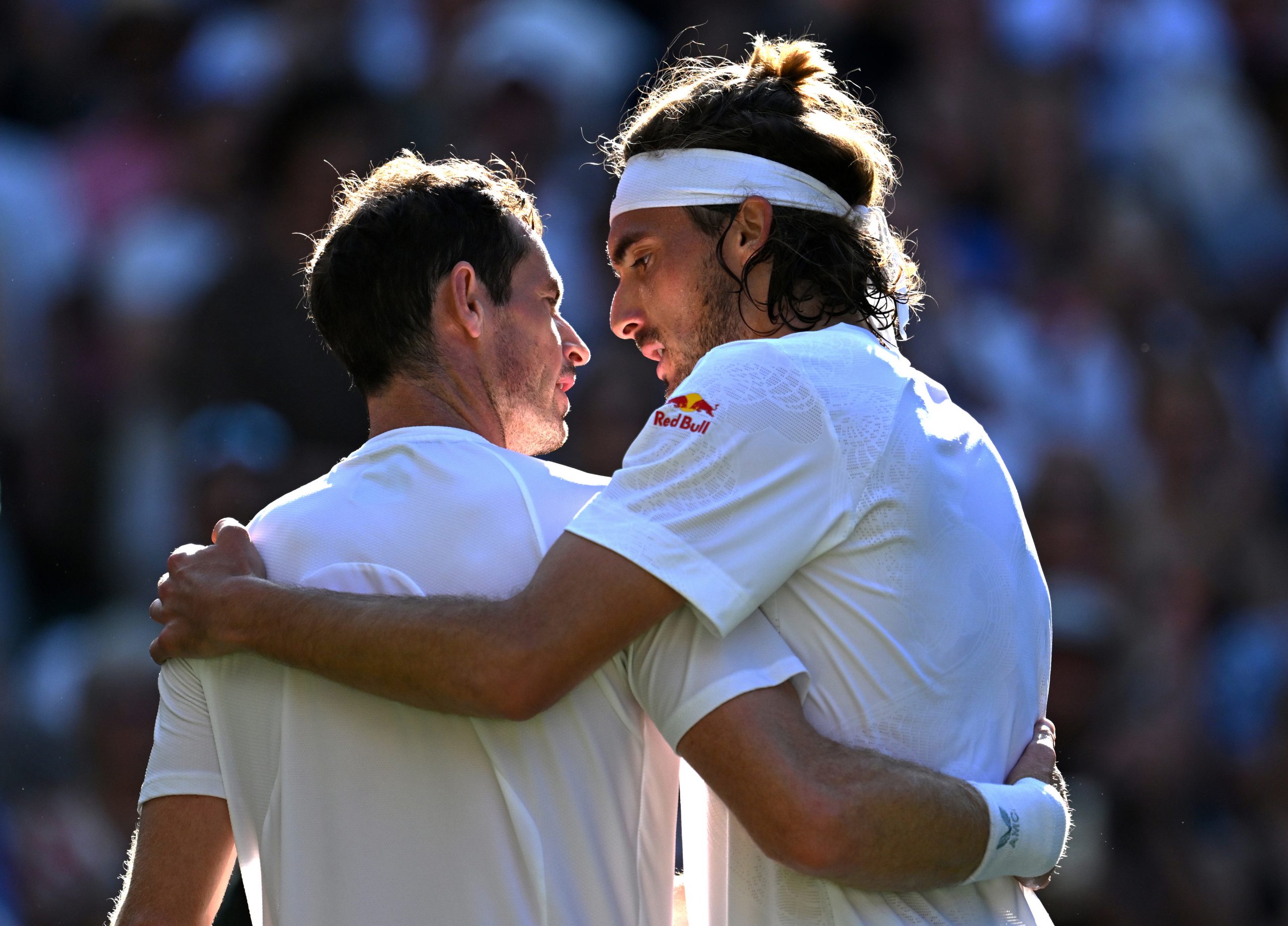 Andy Murray and Stefanos Tsitsipas embrace after the Greek ace defeated Great Britain's best.