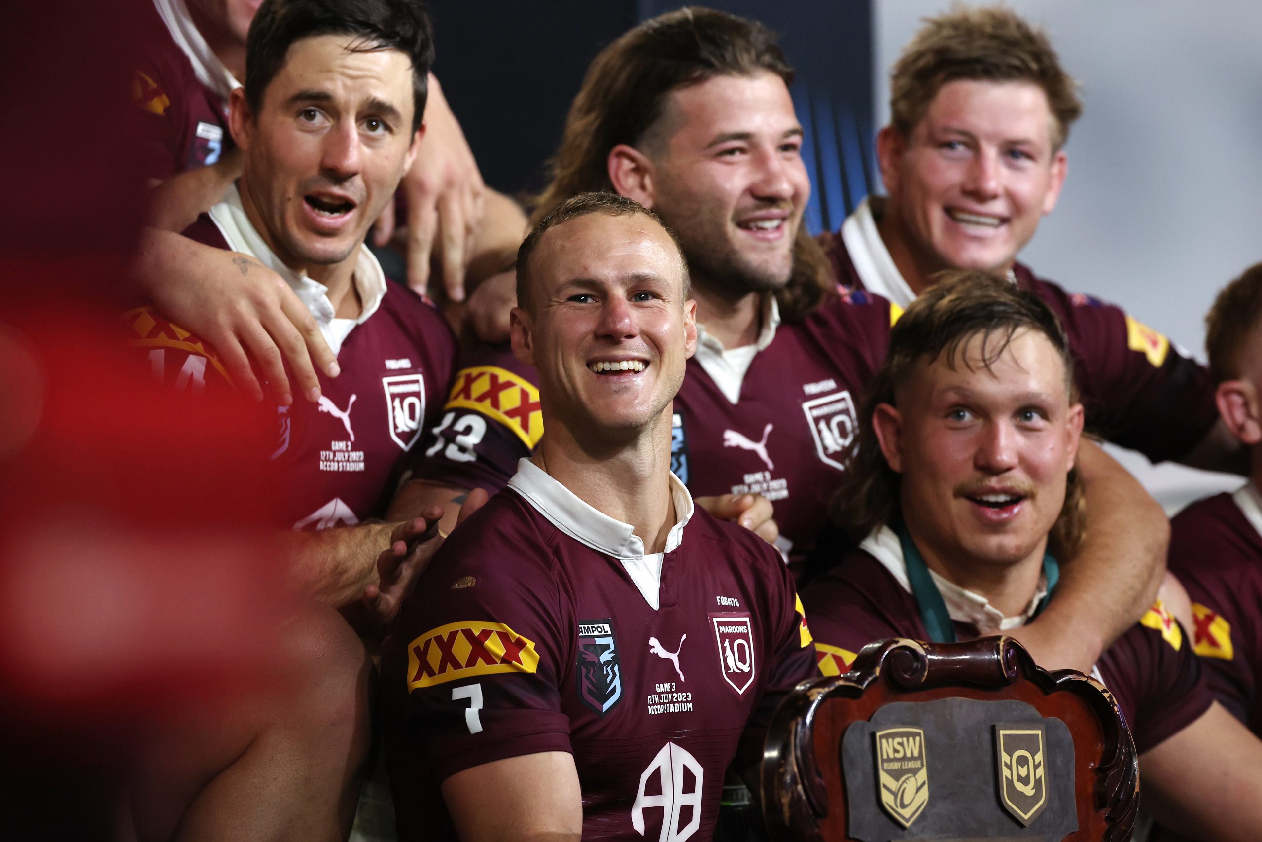 Daly Cherry-Evans of the Maroons celebrates with team mates after winning the series 2-1 after game three of the State of Origin series.