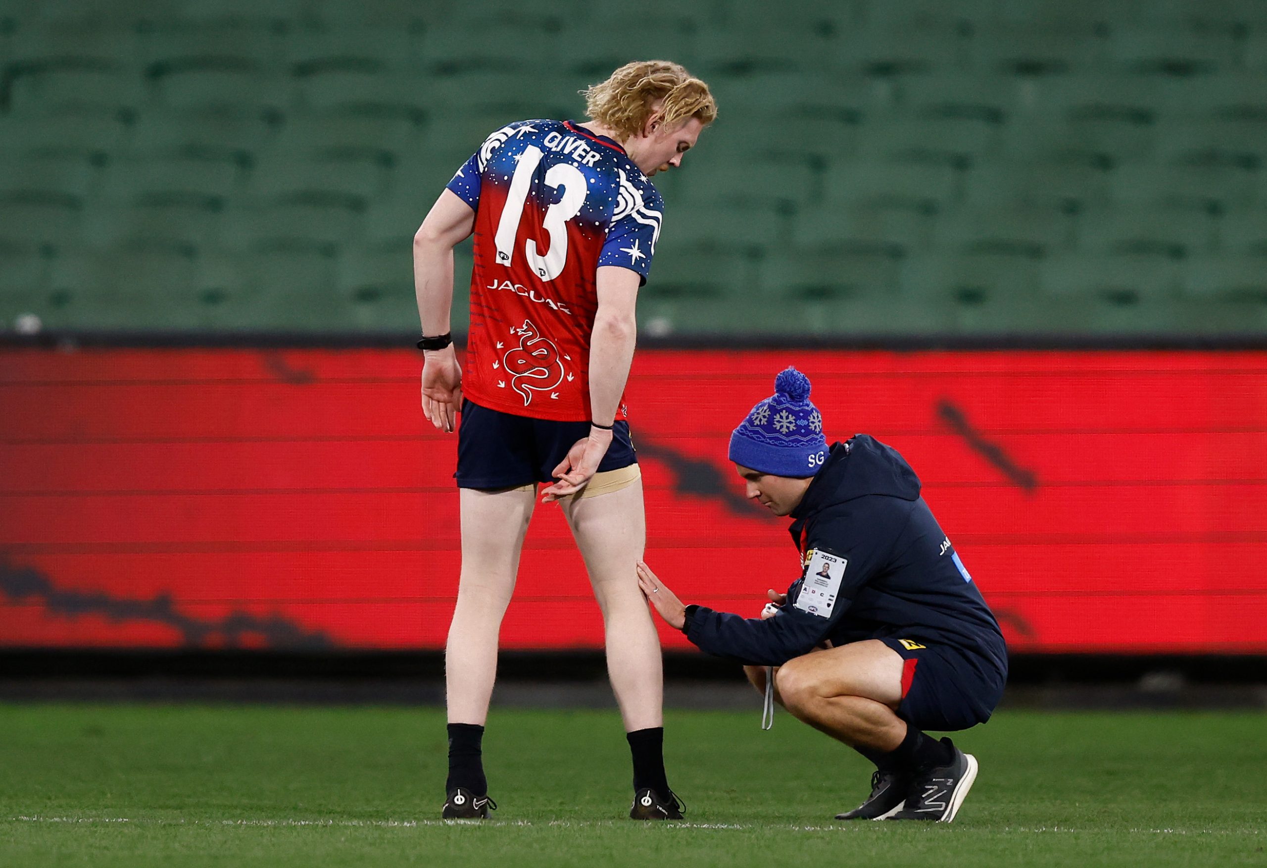 MELBOURNE, AUSTRALIA - JUNE 12: Clayton Oliver of the Demons speaks with medical staff while training after the 2023 AFL Round 13 match between the Melbourne Demons and the Collingwood Magpies at the Melbourne Cricket Ground on June 12, 2023 in Melbourne, Australia. (Photo by Michael Willson/AFL Photos via Getty Images)