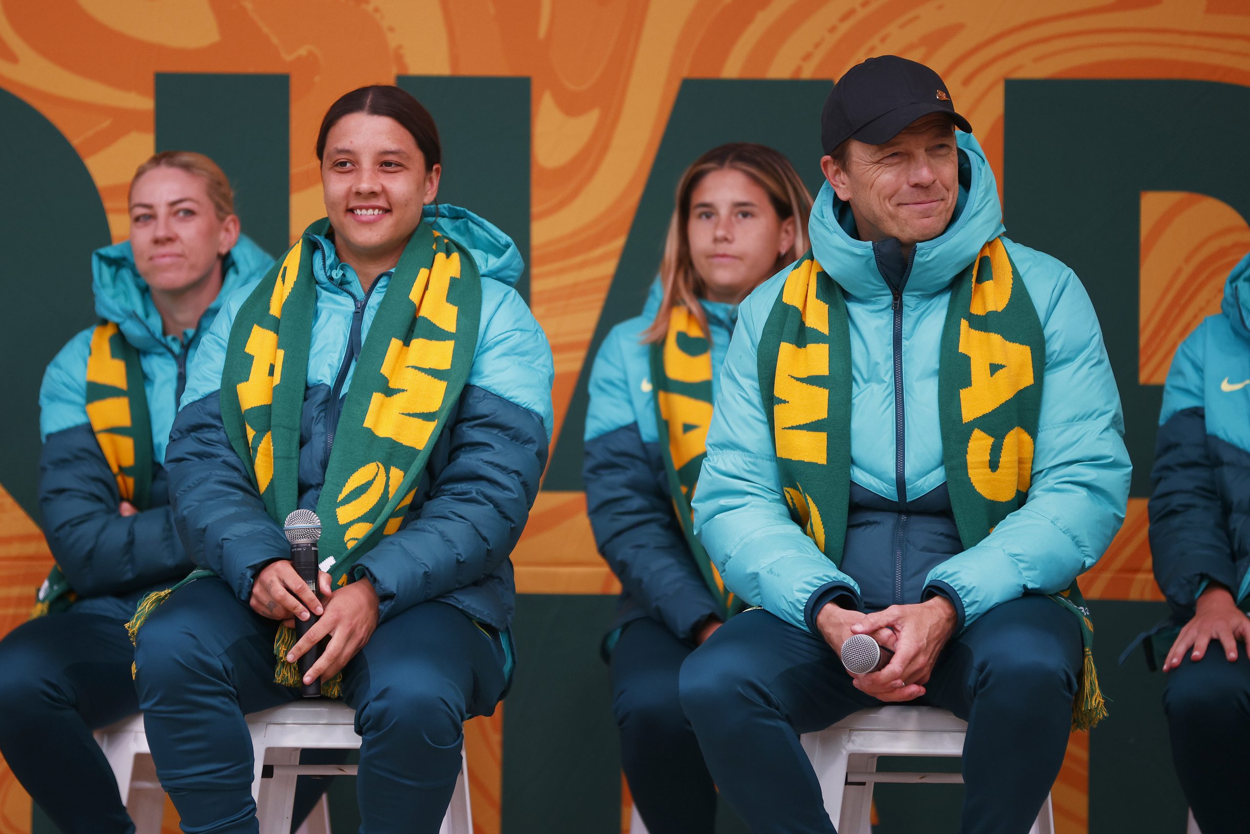 MELBOURNE, AUSTRALIA - JULY 11: Sam Kerr of the Matildas (2L) and Matildas head coach Tony Gustavsson (R) react to fans during the Australia Matildas World Cup squad public presentation at Federation Square on July 11, 2023 in Melbourne, Australia. (Photo by Daniel Pockett/Getty Images)
