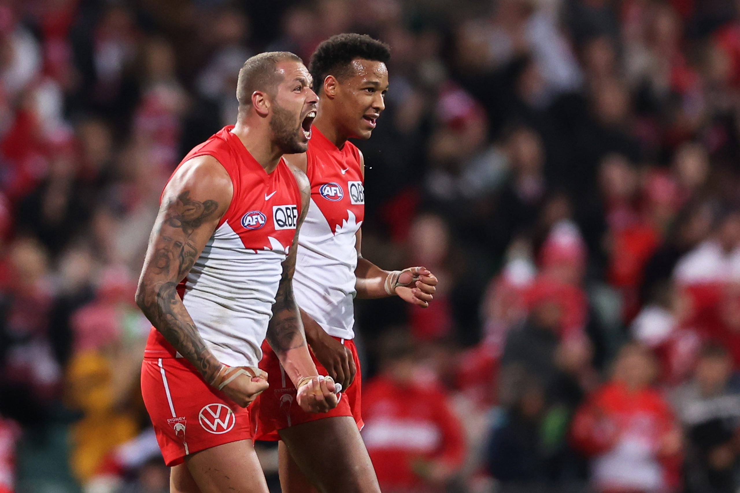 SYDNEY, AUSTRALIA - JULY 13: Lance Franklin and Joel Amartey of the Swans celebrate victory after the round 18 AFL match between Sydney Swans and Western Bulldogs at Sydney Cricket Ground, on July 13, 2023, in Sydney, Australia. (Photo by Matt King/AFL Photos/via Getty Images)