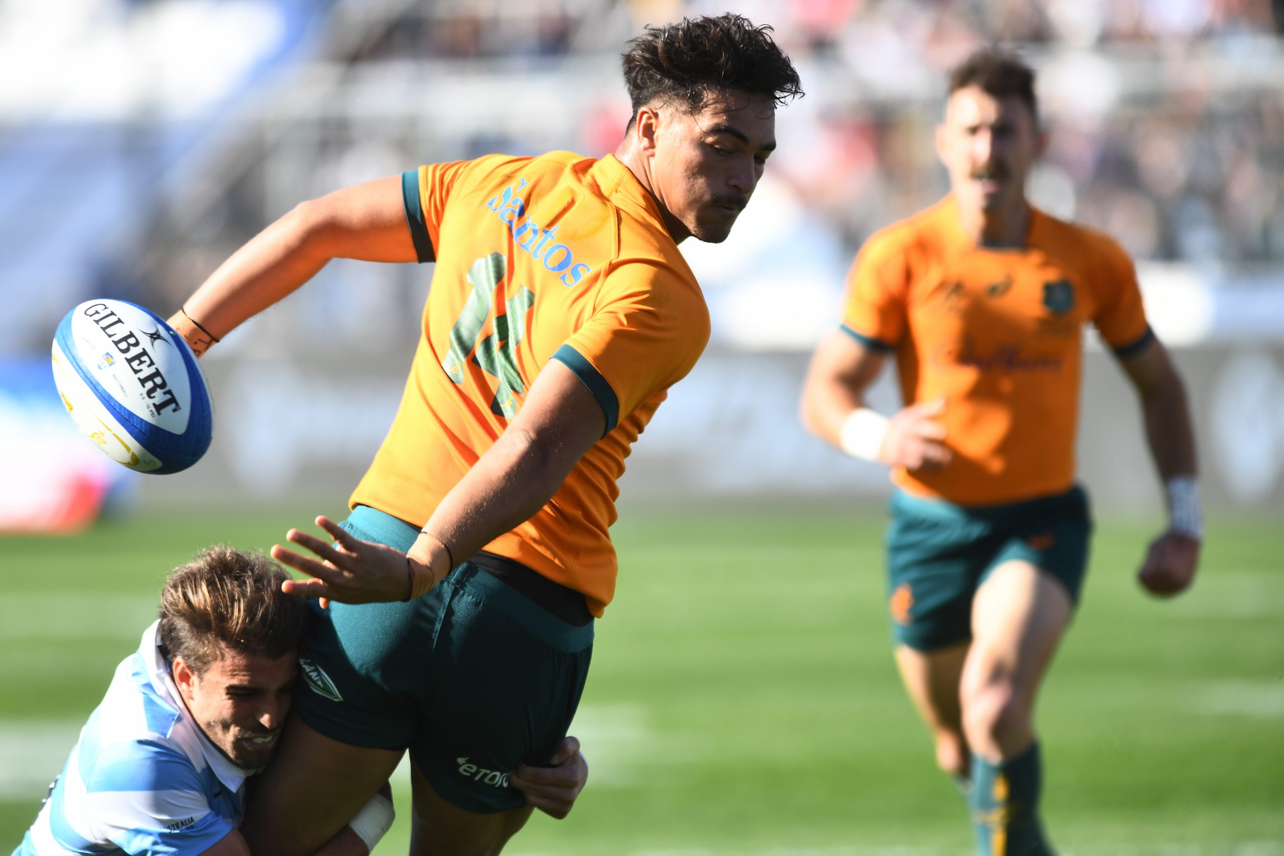 Jordan Petaia of Australia attempts to avoid a tackle.