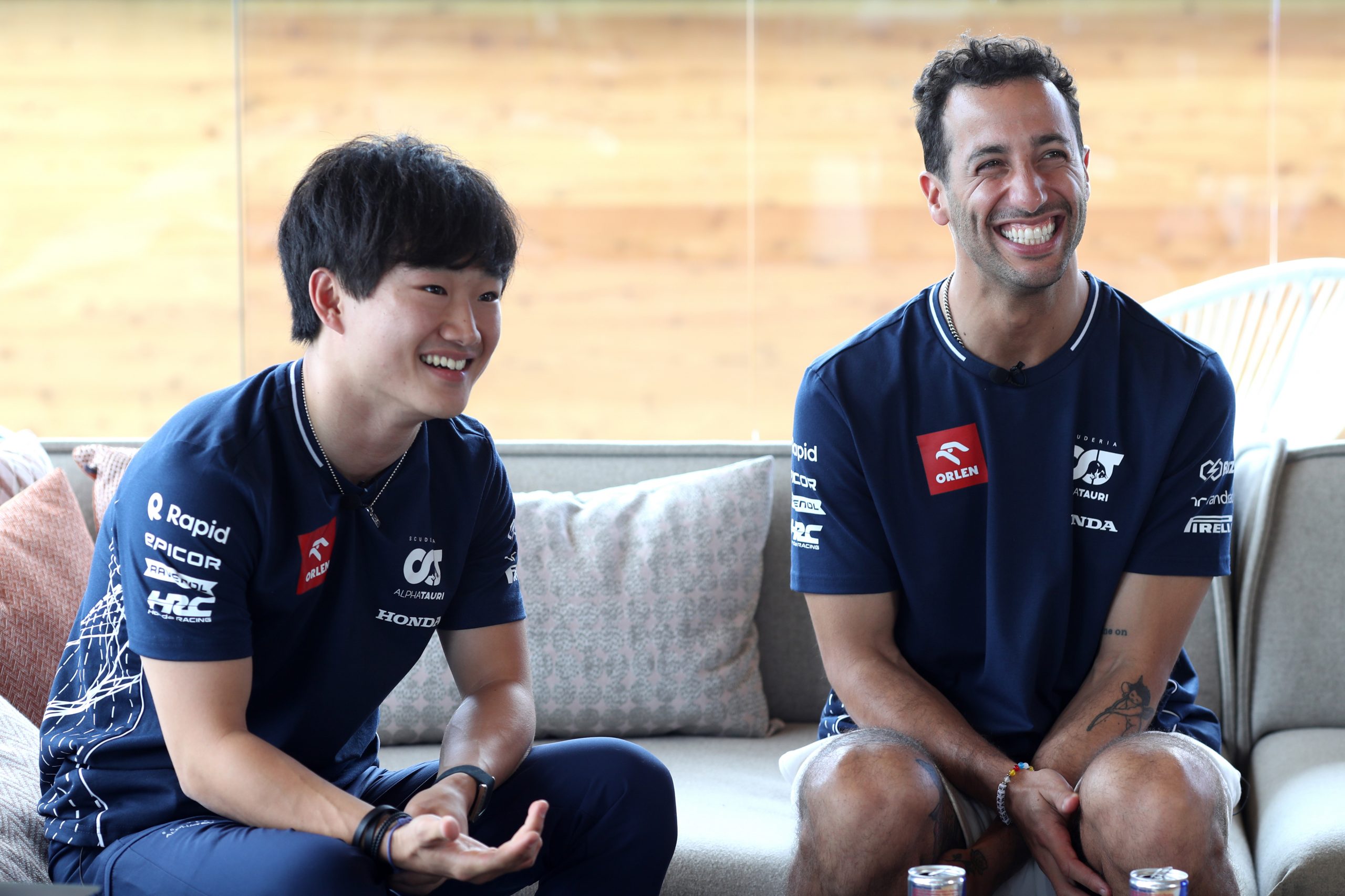 Yuki Tsunoda of Japan and Scuderia AlphaTauri and Daniel Ricciardo of Australia and Scuderia AlphaTauri talk to the media in the Paddock during previews ahead of the F1 Grand Prix of Hungary at Hungaroring on July 20, 2023 in Budapest, Hungary. (Photo by Peter Fox/Getty Images)