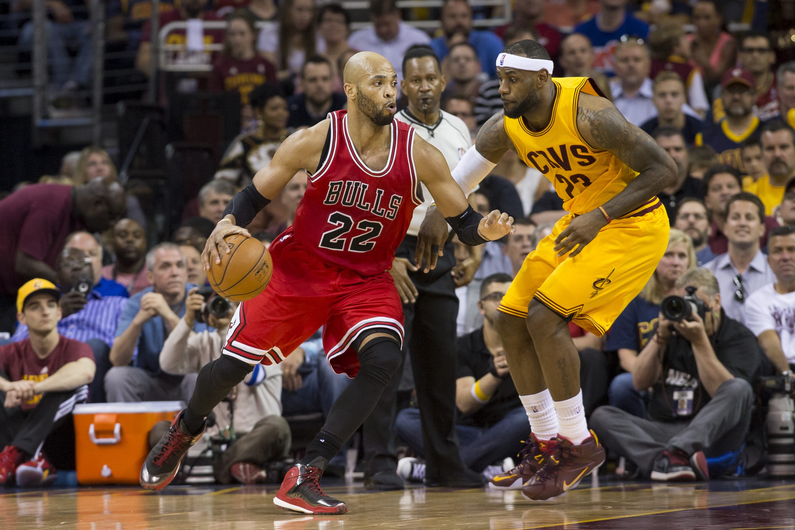 CLEVELAND, OH - MAY 6: Taj Gibson #22 of the Chicago Bulls drives around LeBron James #23 of the Cleveland Cavaliers in the first half during Game Two in the Eastern Conference Semifinals of the 2015 NBA Playoffs 2015 at Quicken Loans Arena on May 6, 2015 in Cleveland, Ohio. NOTE TO USER: User expressly acknowledges and agrees that, by downloading and or using this photograph, User is consenting to the terms and conditions of the Getty Images License Agreement. (Photo by Jason Miller/Getty Image