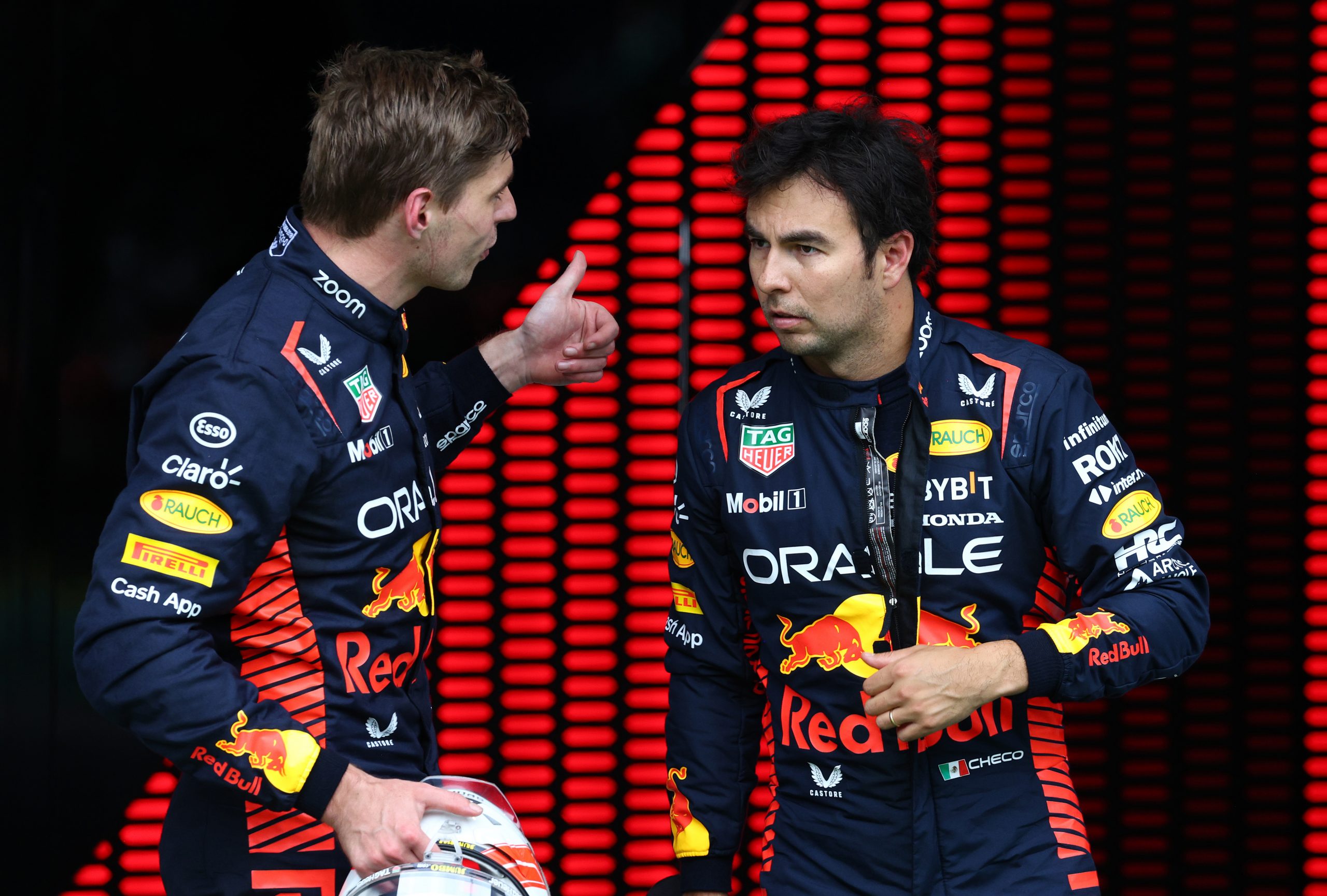 Sprint winner Max Verstappen of the Netherlands and Red Bull Racing and Second placed Sergio Perez of Mexico talk in parc ferme.