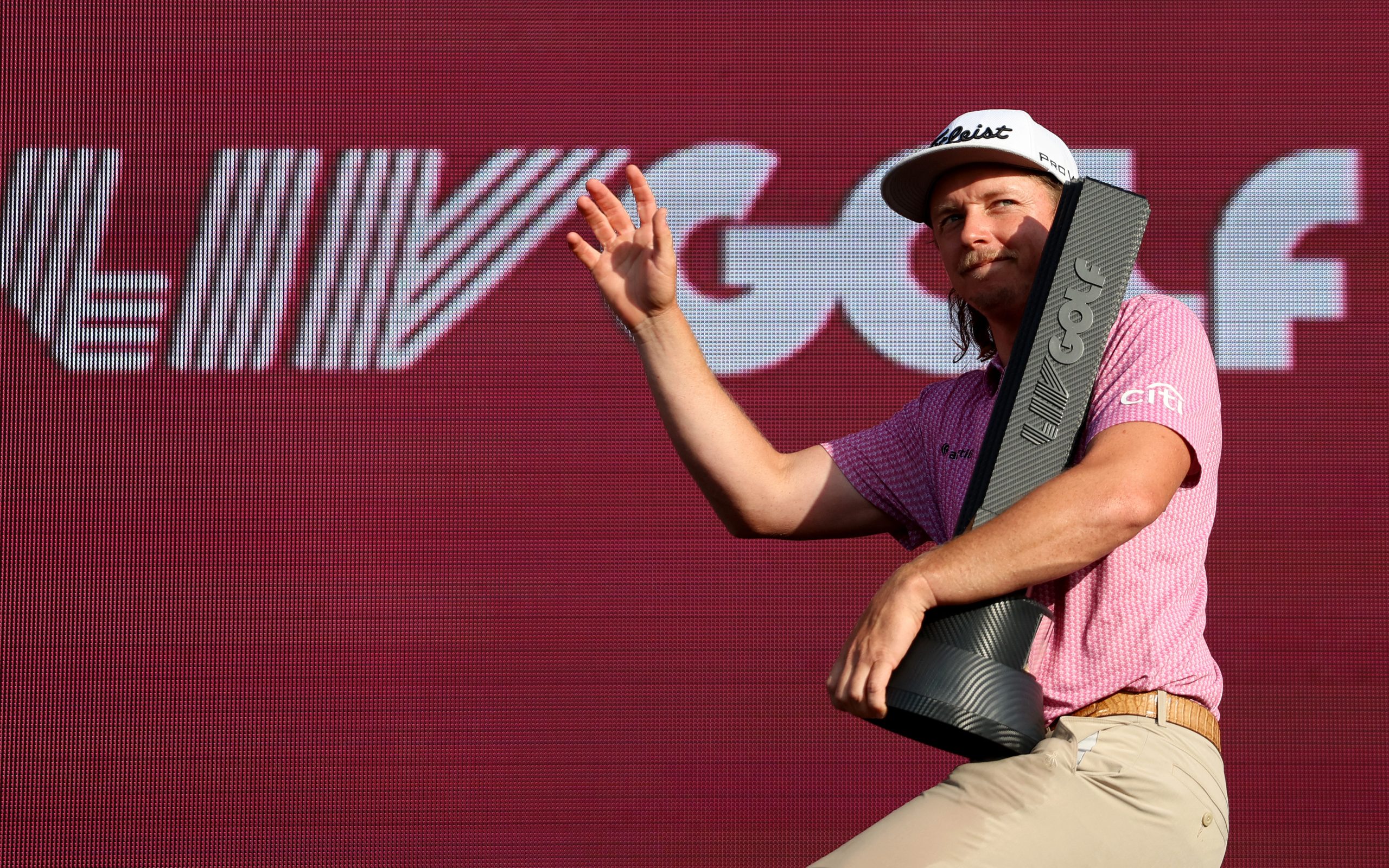 Cameron Smith of Australia celebrates with the trophy after his win on day three of LIV Golf - London at The Centurion Club on July 09, 2023 in St Albans, England. (Photo by Tom Dulat/Getty Images)