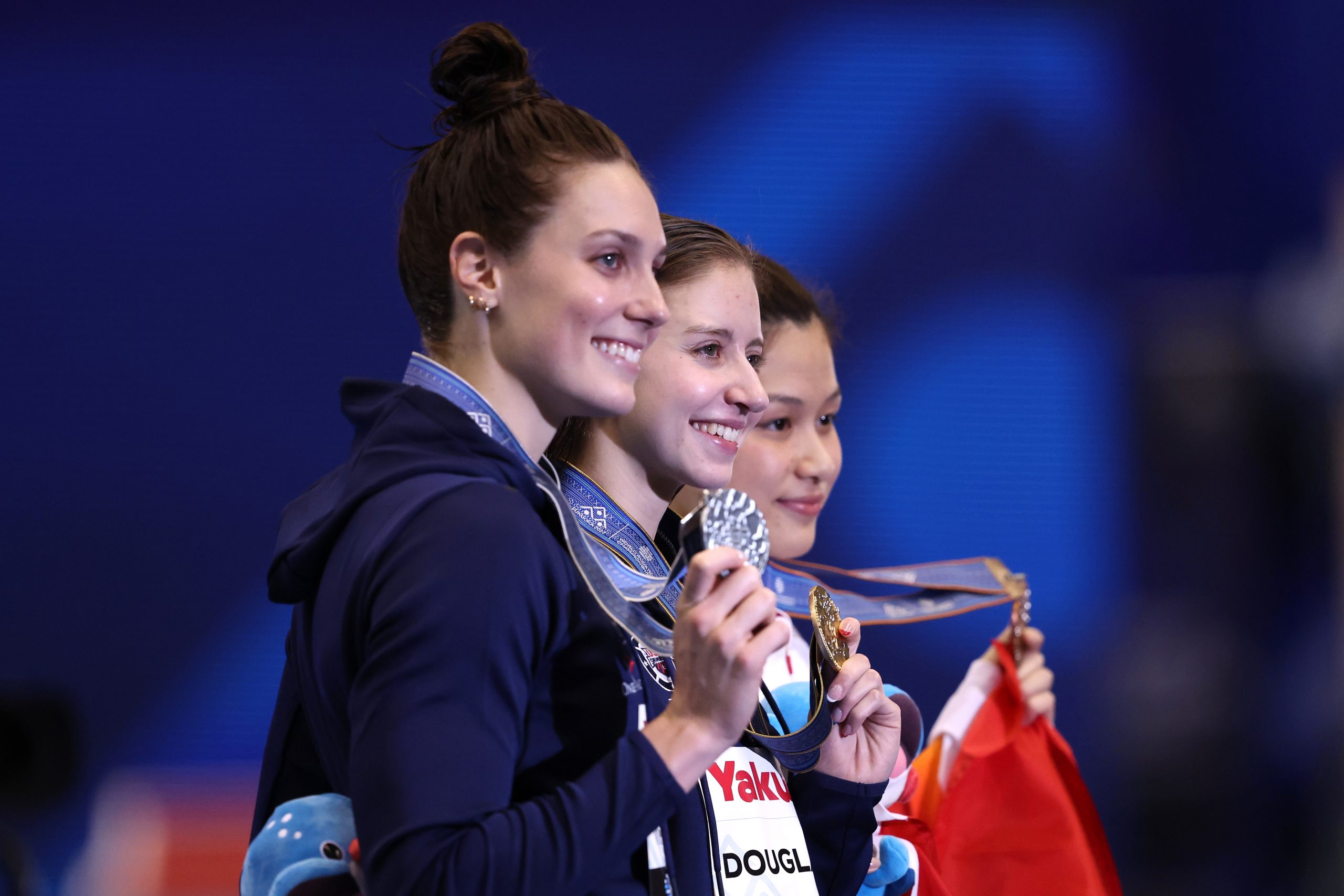 FUKUOKA, JAPAN - JULY 24:  (L-R) Silver medalist Alex Walsh of Team United States, gold medallist Kate Douglass of Team United States and bronze medallist Yiting Yu of Team China pose during the medal ceremony for Women's 200m Individual Medley Final on day two of the Fukuoka 2023 World Aquatics Championships at Marine Messe Fukuoka Hall A on July 24, 2023 in Fukuoka, Japan. (Photo by Sarah Stier/Getty Images)
