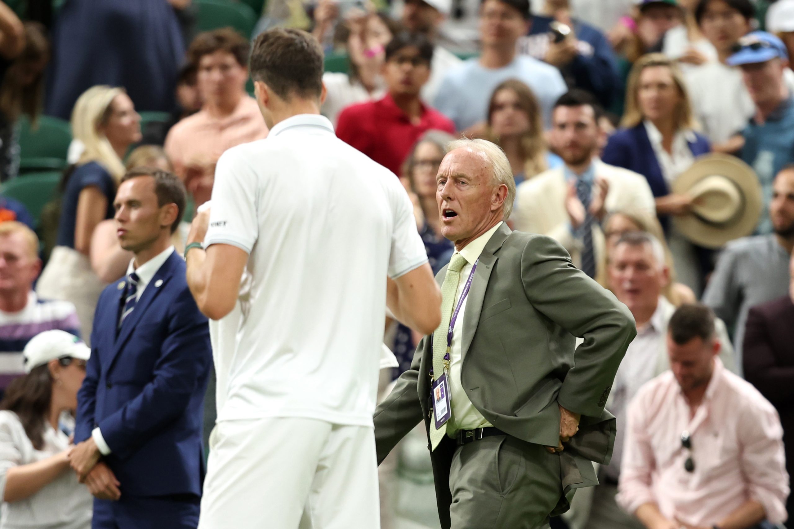 Referee, Gerry Armstrong suspends the match between Novak Djokovic and Hubert Hurkacz during day seven at Wimbledon.