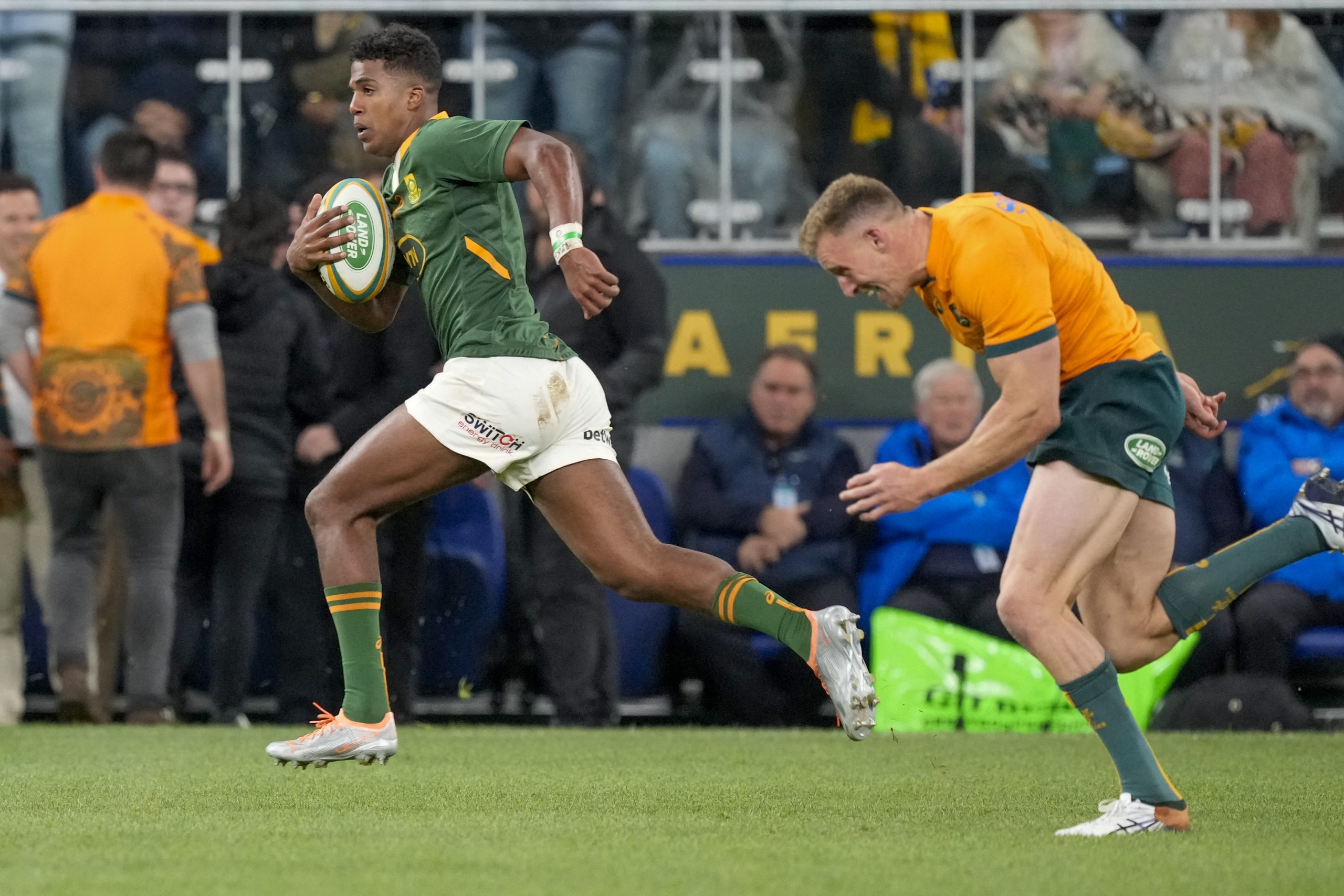 South Africa's Canan Moodie runs away from Australia's Reece Hodge to score a try.