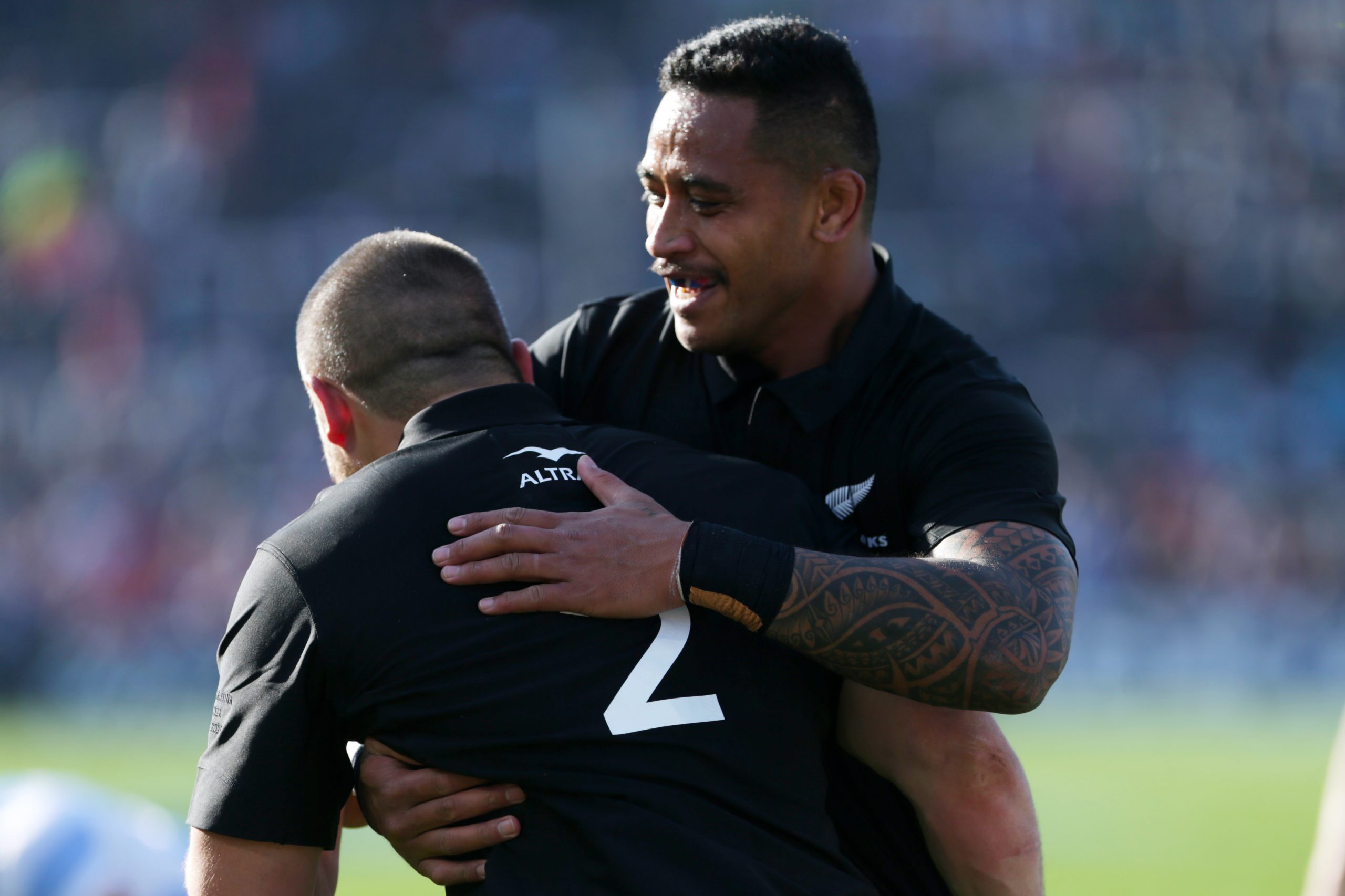 Dane Coles of New Zealand celebrates with teammate Shannon Frizell after scoring a try.