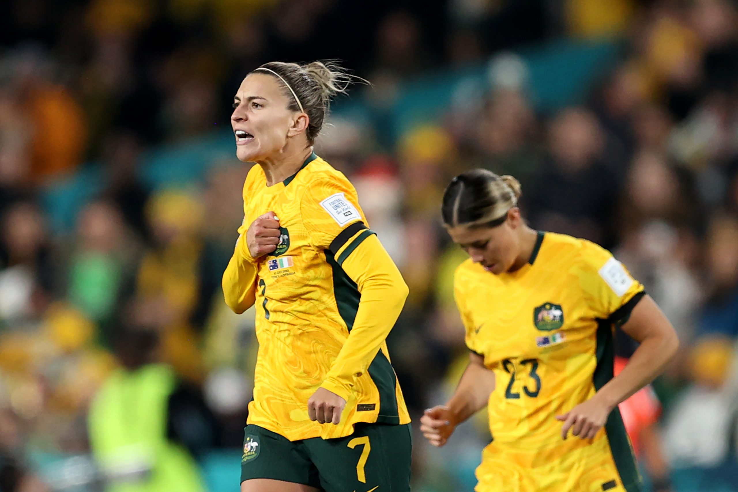 SYDNEY, AUSTRALIA - JULY 20: Steph Catley (L) of Australia celebrates after scoring her team's first goal  during the FIFA Women's World Cup Australia & New Zealand 2023 Group B match between Australia and Ireland at Stadium Australia on July 20, 2023 in Sydney, Australia. (Photo by Brendon Thorne/Getty Images)