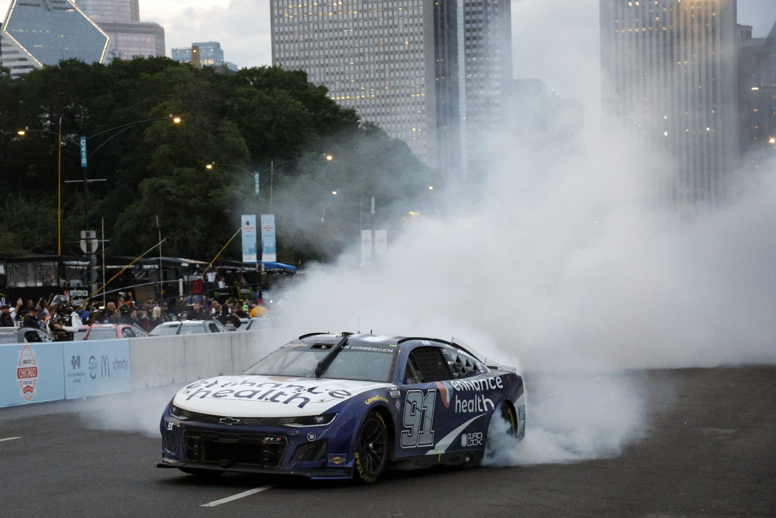 Shane Van Gisbergen celebrates victory with a burnout on the streets of Chicago.