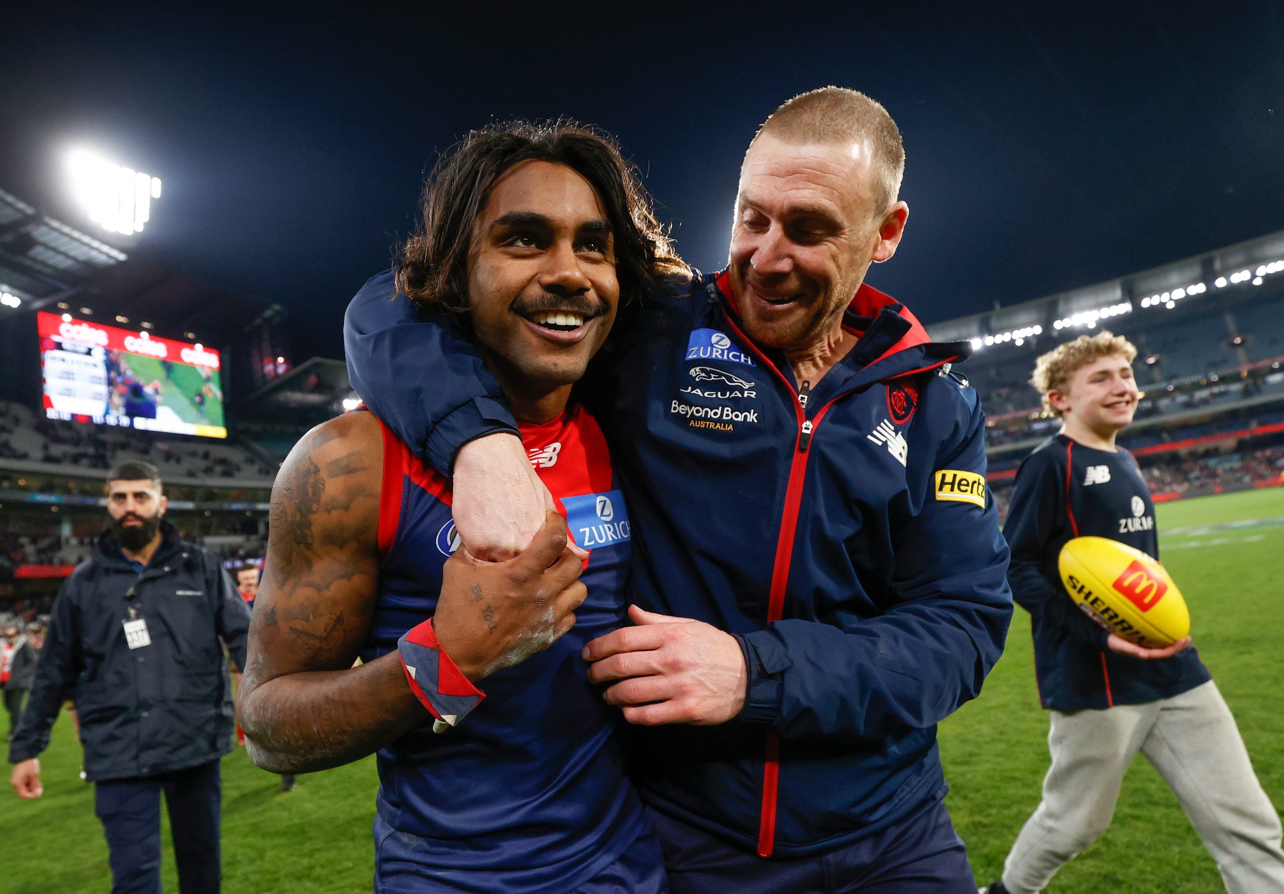 Simon Goodwin, Senior Coach of the Demons and Kysaiah Pickett of the Demons celebrate during the 2022 AFL Round 22 match between the Melbourne Demons and the Carlton Blues at the Melbourne Cricket Ground on August 13, 2022 in Melbourne, Australia. (Photo by Michael Willson/AFL Photos)