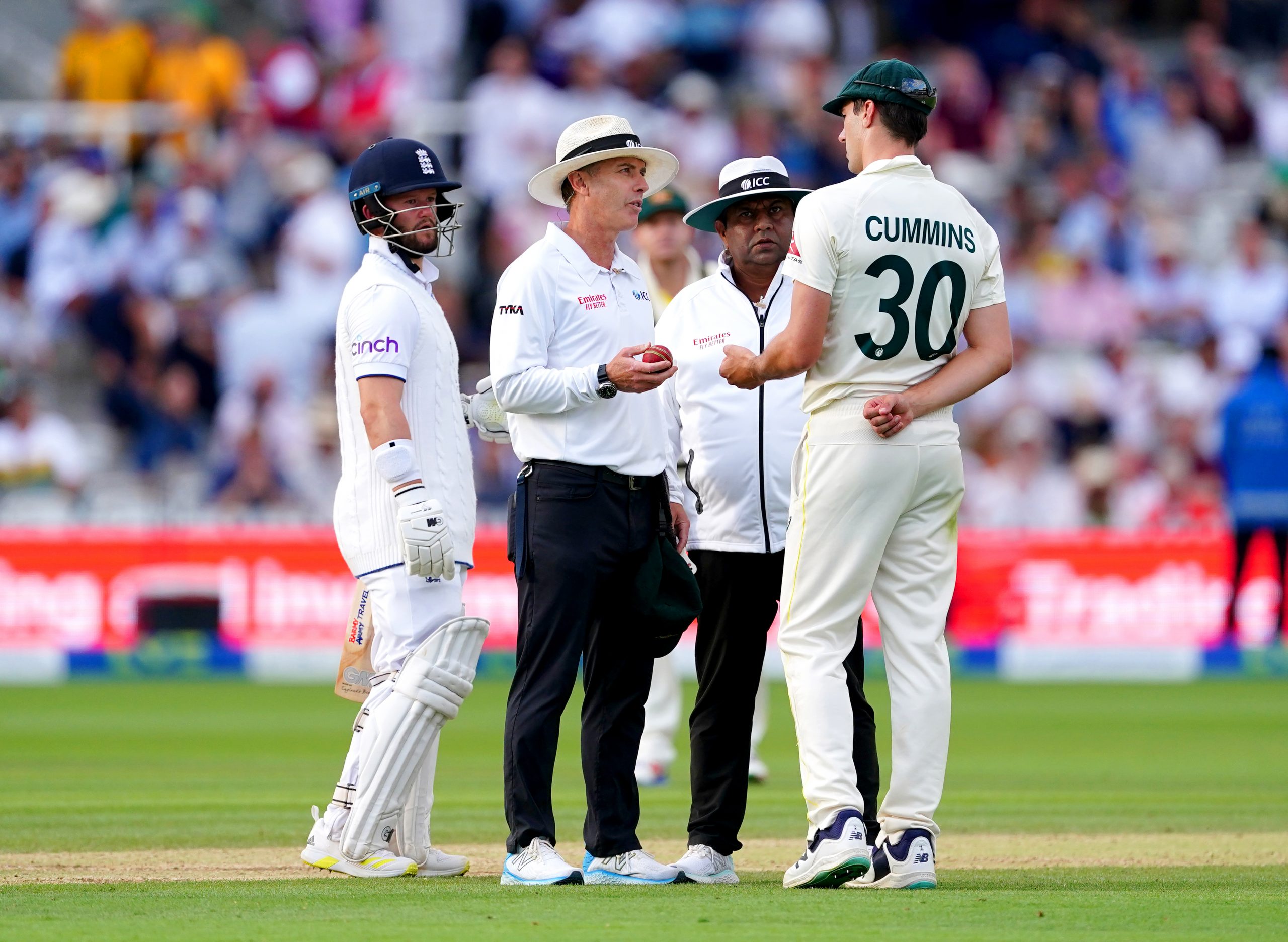 Australia's Pat Cummins speaks to the umpires after England's Ben Duckett is ruled not out following a catch from Mitchell Starc (not pictured) during day four of the second Ashes test match at Lord's, London. Picture date: Saturday July 1, 2023. (Photo by Mike Egerton/PA Images via Getty Images)