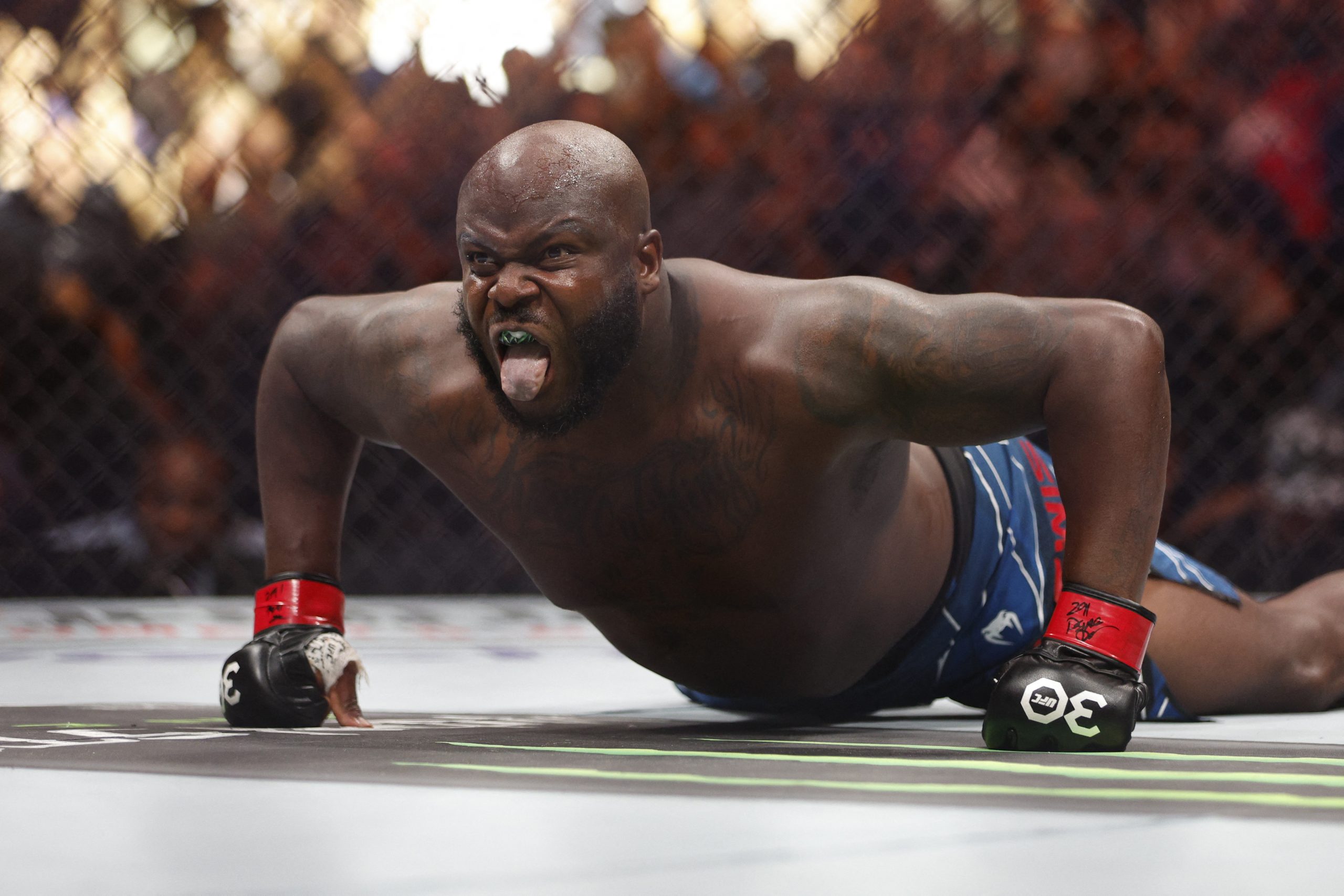 Jul 29, 2023; Salt Lake City, Utah, USA; Derrick Lewis (red gloves) reacts to defeating Marcos Rogerio De Lima (blue gloves) during UFC 291 at Delta Center. Mandatory Credit: Jeff Swinger-USA TODAY Sports