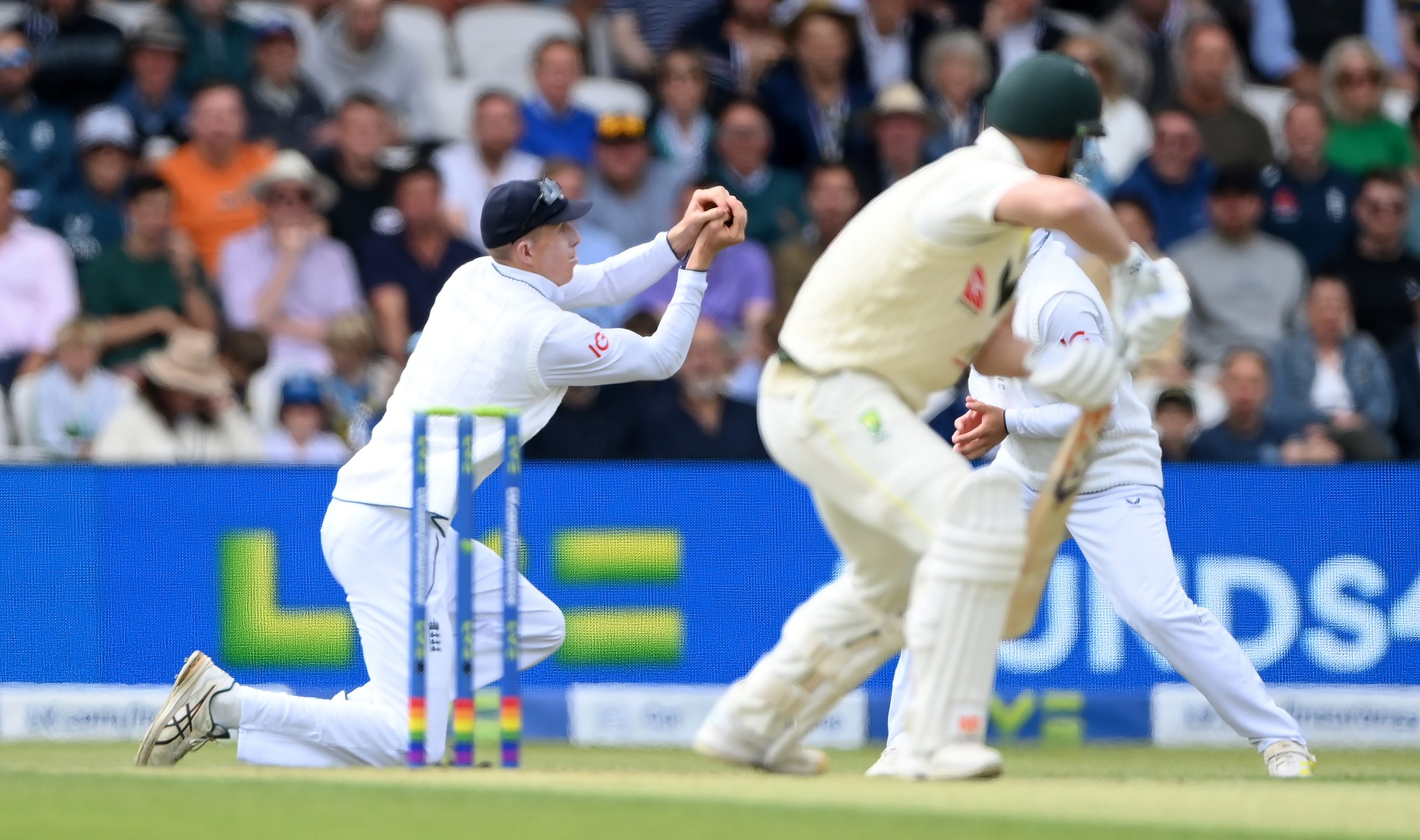 Zak Crawley catches out David Warner.