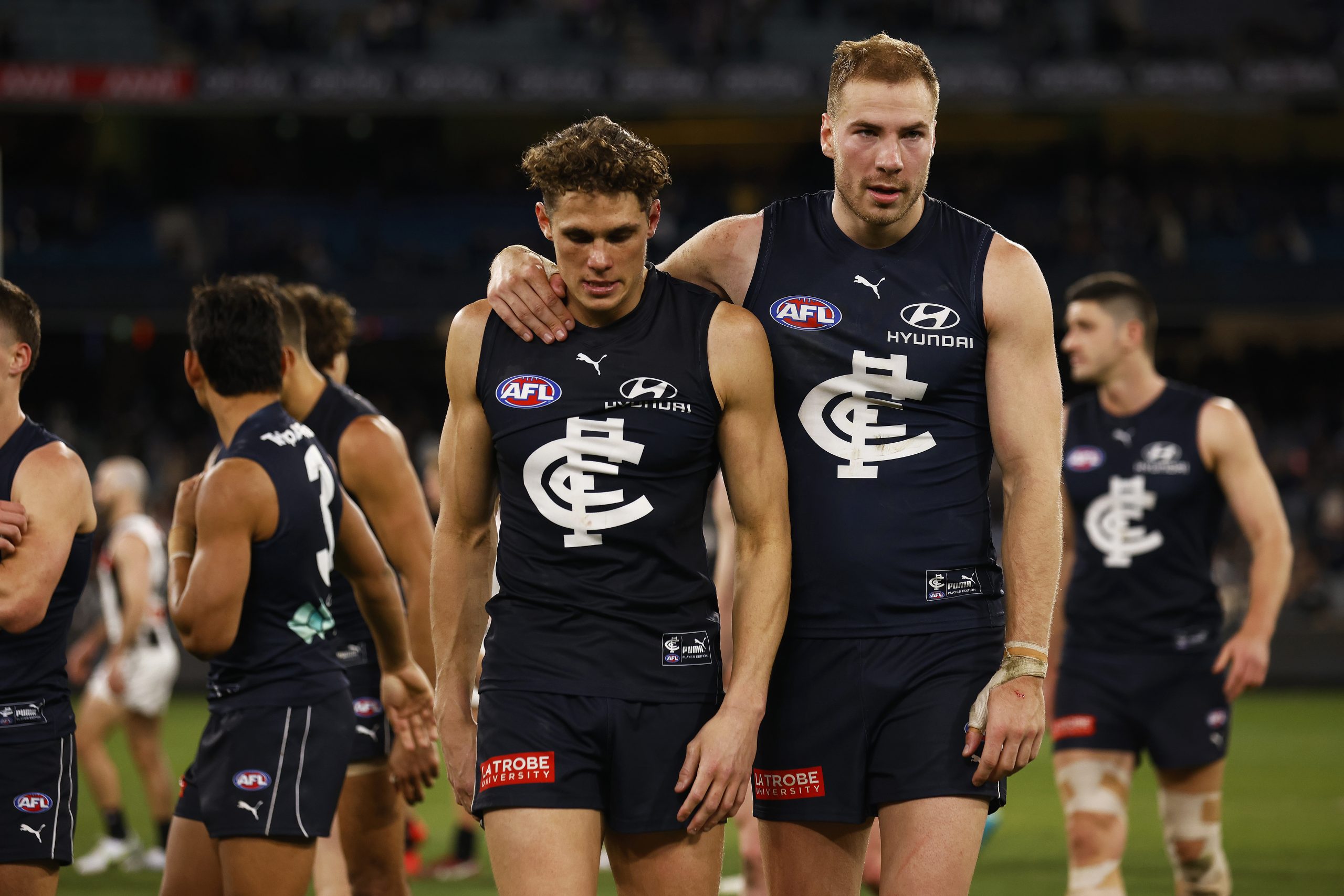 MELBOURNE, AUSTRALIA - AUGUST 21: Harry McKay of the Blues and Charlie Curnow of the Blues look dejected after the round 23 AFL match between the Carlton Blues and the Collingwood Magpies at Melbourne Cricket Ground on August 21, 2022 in Melbourne, Australia. (Photo by Daniel Pockett/Getty Images)