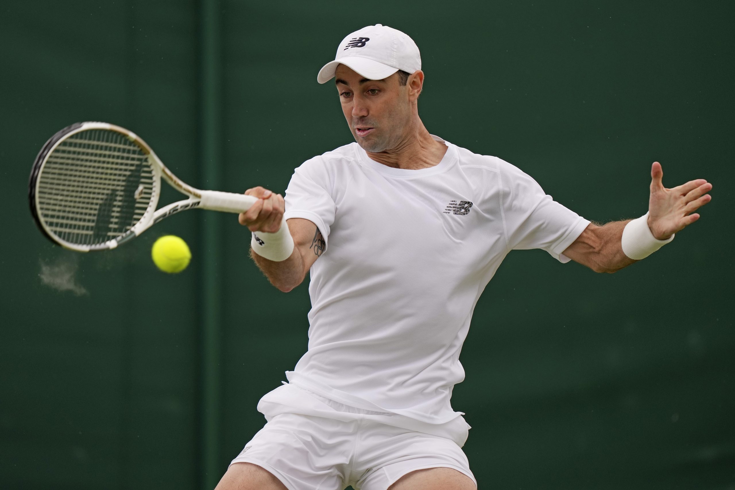 Australia's Jordan Thompson returns to Brandon Nakashima of the US during their first round men's singles match on day one of Wimbledon.