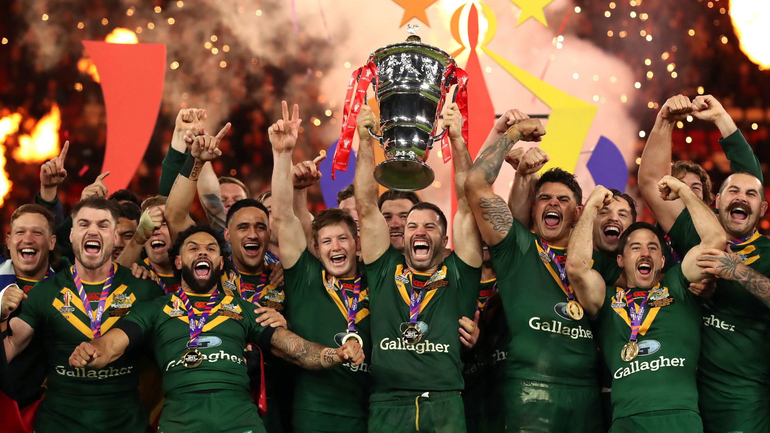 Kangaroos captain James Tedesco lifts the Rugby League World Cup trophy after Australia's win over Samoa in the 2022 tournament final.