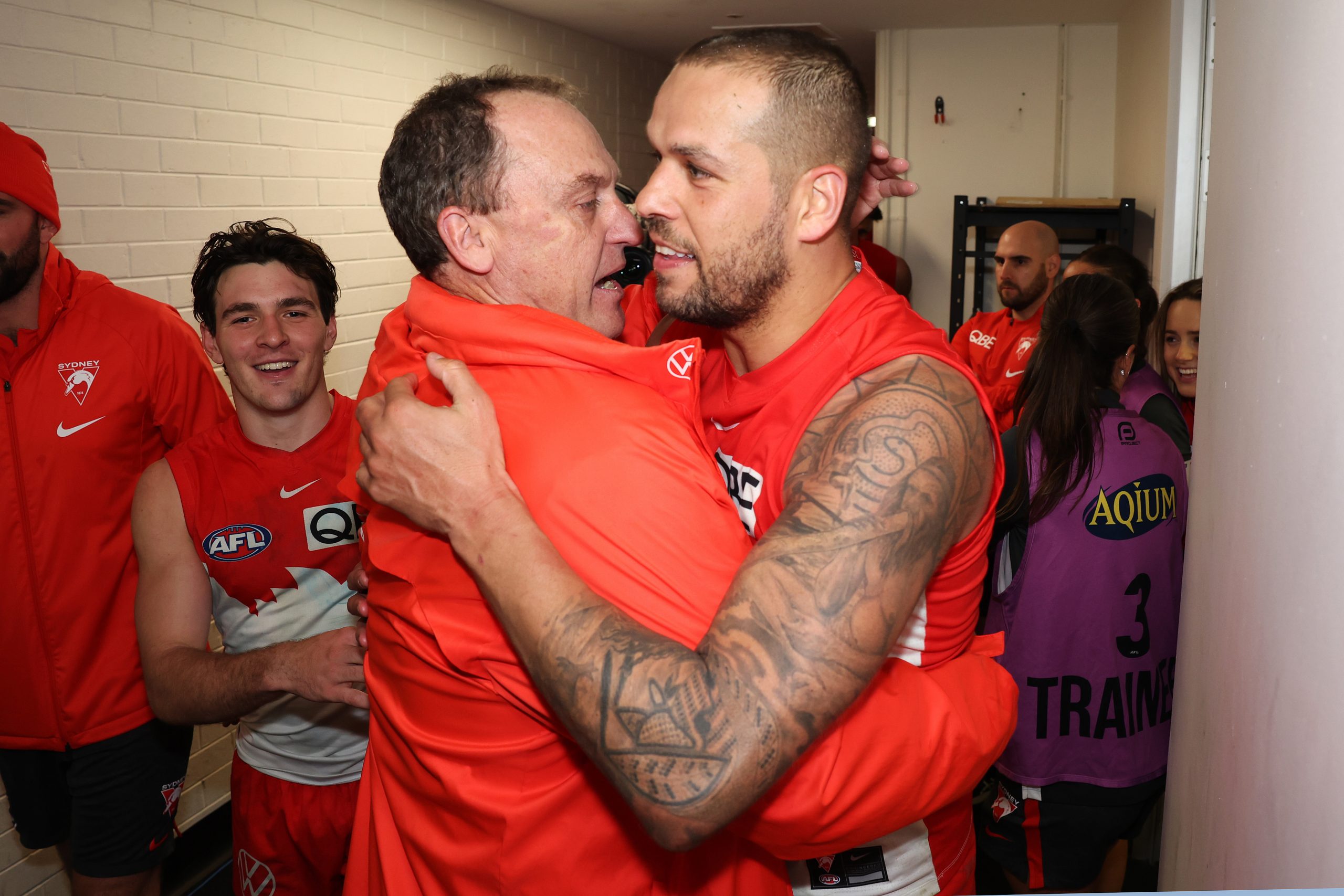 SYDNEY, AUSTRALIA - JULY 13: Swans head coach John Longmire celebrates with Lance Franklin of the Swans after victory during the round 18 AFL match between Sydney Swans and Western Bulldogs at Sydney Cricket Ground, on July 13, 2023, in Sydney, Australia. (Photo by Mark Metcalfe/AFL Photos/via Getty Images)