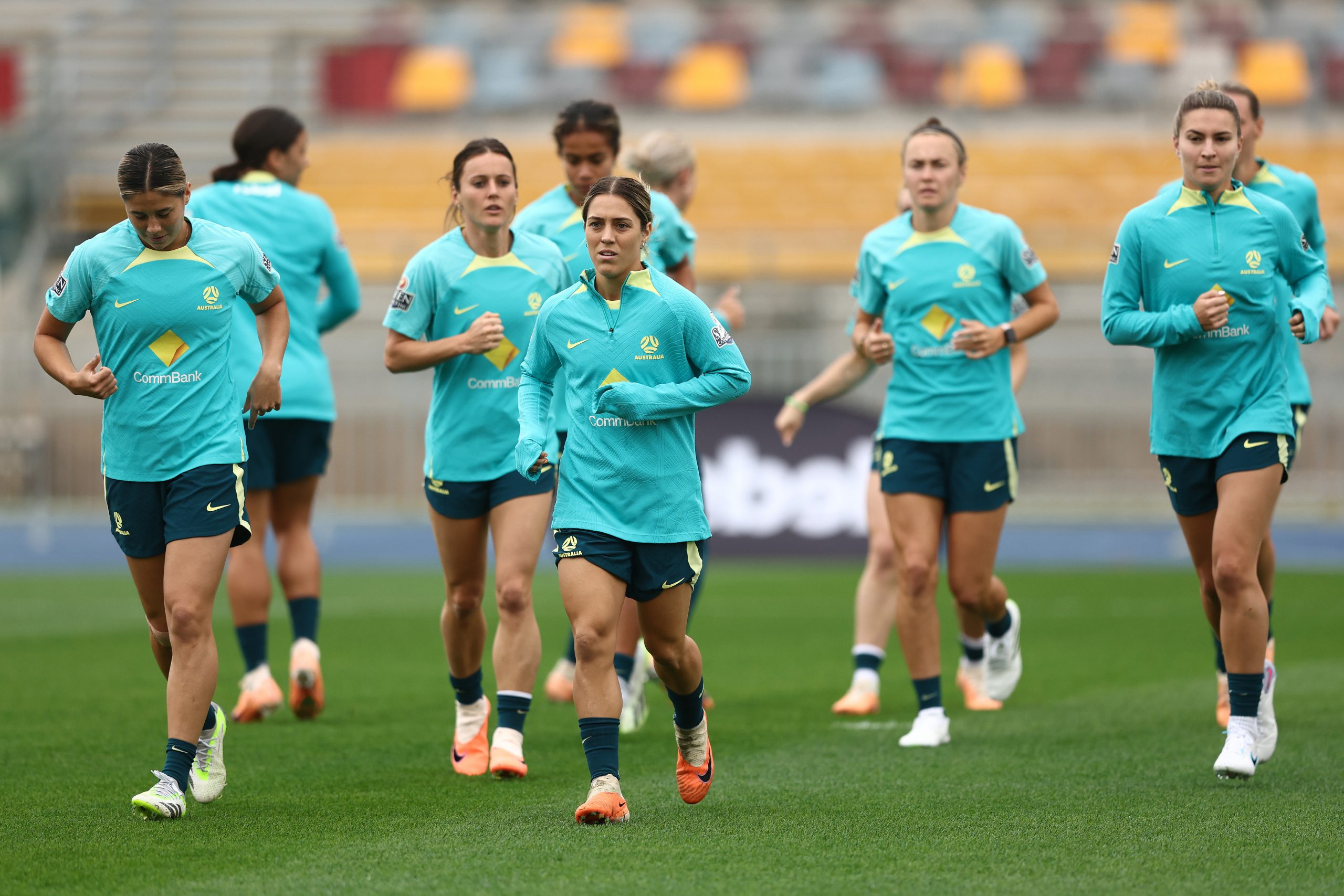 BRISBANE, AUSTRALIA - JULY 17: Katrina Gorry and team run during an Australia Matildas training session ahead of the FIFA Women's World Cup Australia & New Zealand 2023 Group B match between Australia and Ireland at Queensland Sport and Athletics Centre on July 17, 2023 in Brisbane, Australia. (Photo by Chris Hyde/Getty Images)