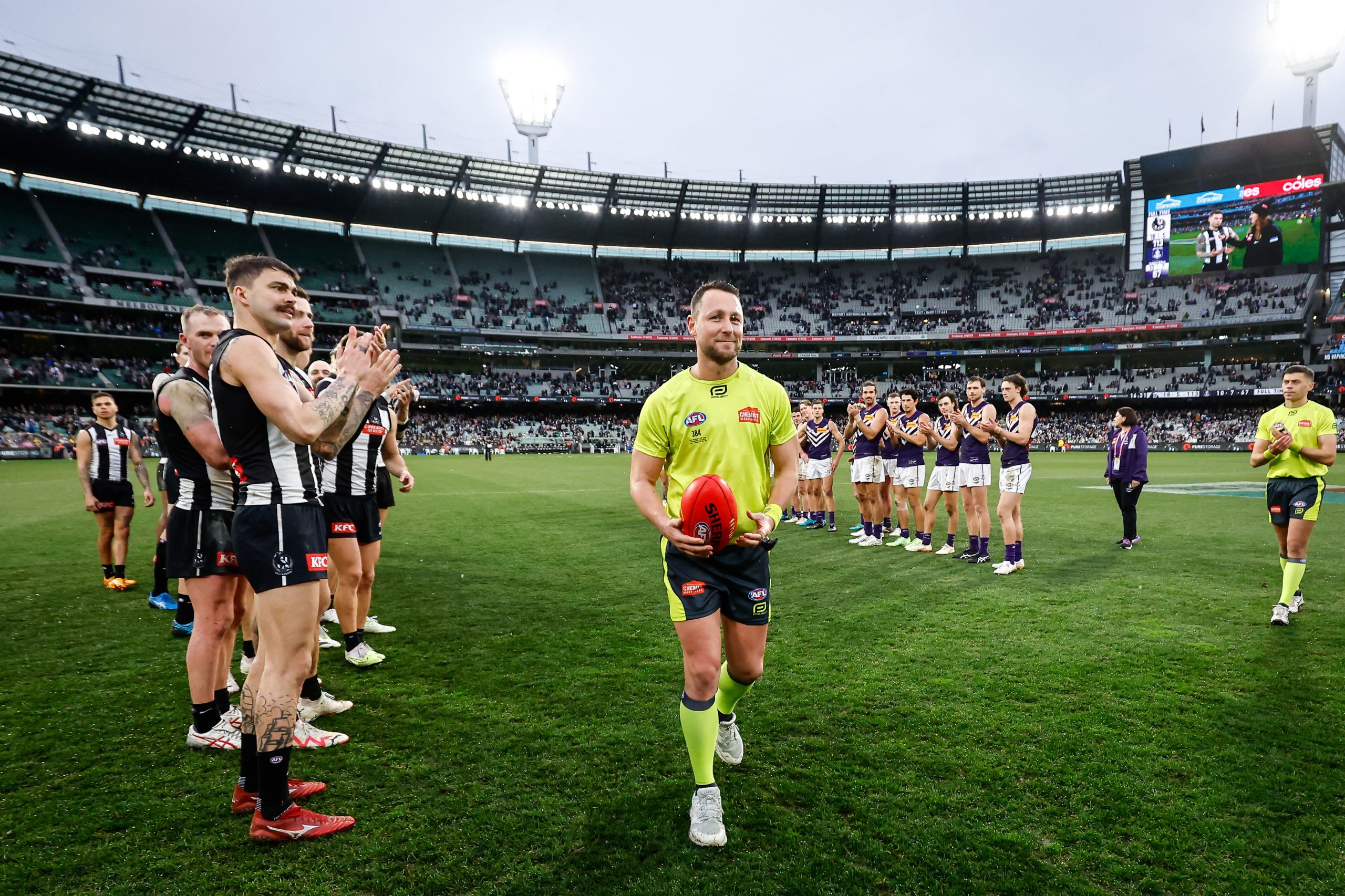 MELBOURNE, AUSTRALIA - JULY 15: AFL Field Umpire, Brett Rosebury receives a guard of honour for his 500th game during the 2023 AFL Round 18 match between the Collingwood Magpies and the Fremantle Dockers at the Melbourne Cricket Ground on July 15, 2023 in Melbourne, Australia. (Photo by Dylan Burns/AFL Photos via Getty Images)