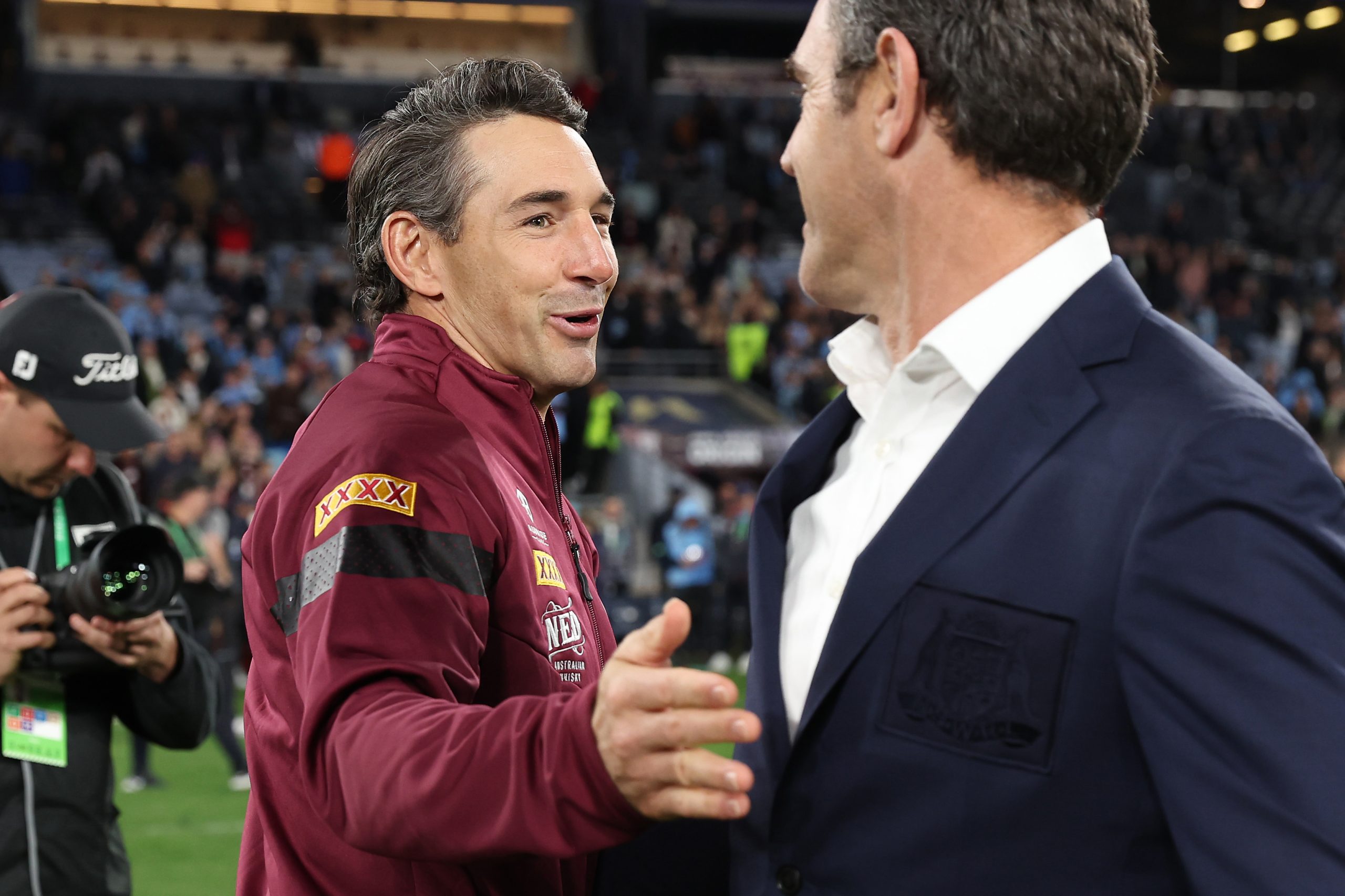 Maroons coach Billy Slater and Blues coach Brad Fittler embrace after game three of the State of Origin series.