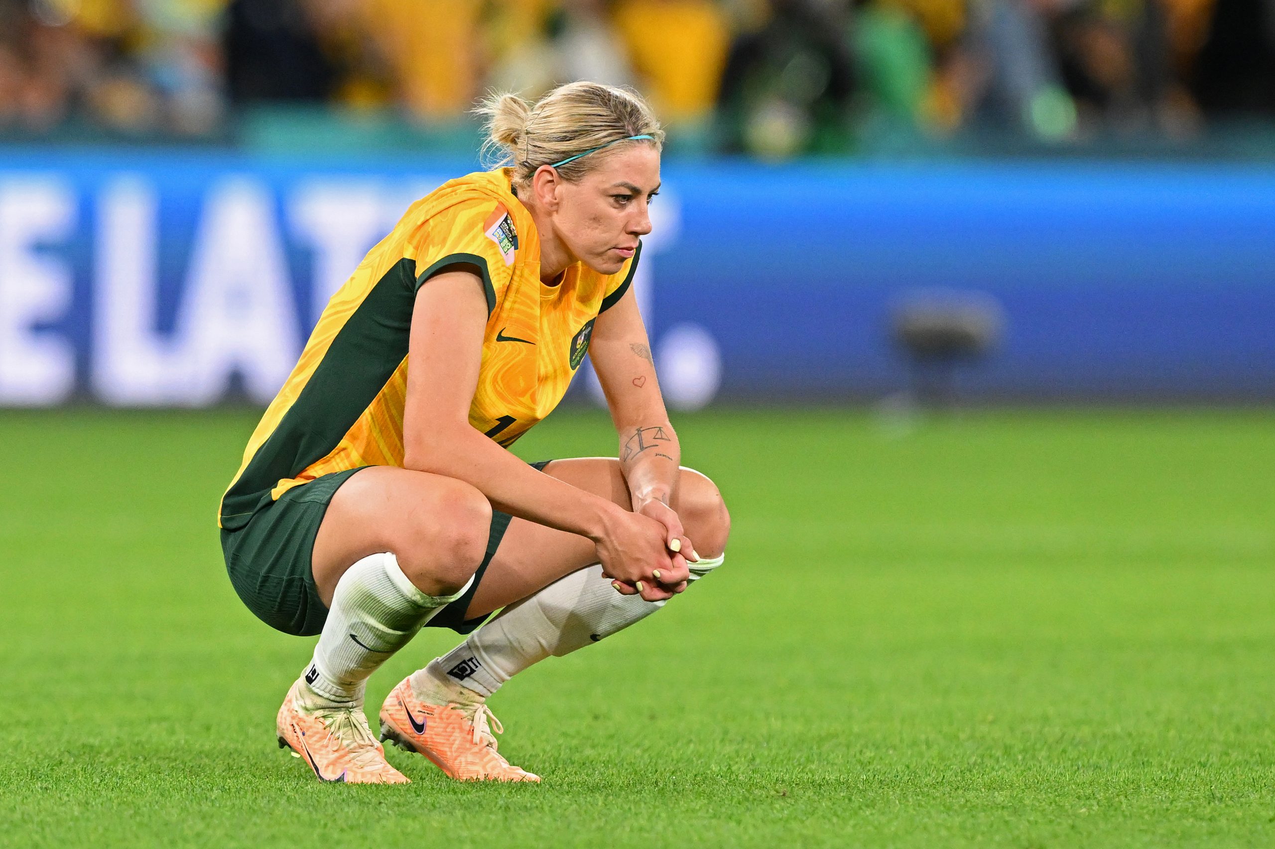 BRISBANE, AUSTRALIA - JULY 27: Alanna Kennedy of Australia shows dejection after her team's 2-3 defeat in the FIFA Women's World Cup Australia & New Zealand 2023 Group B match between Australia and Nigeria at Brisbane Stadium on July 27, 2023 in Brisbane, Australia. (Photo by Bradley Kanaris/Getty Images)