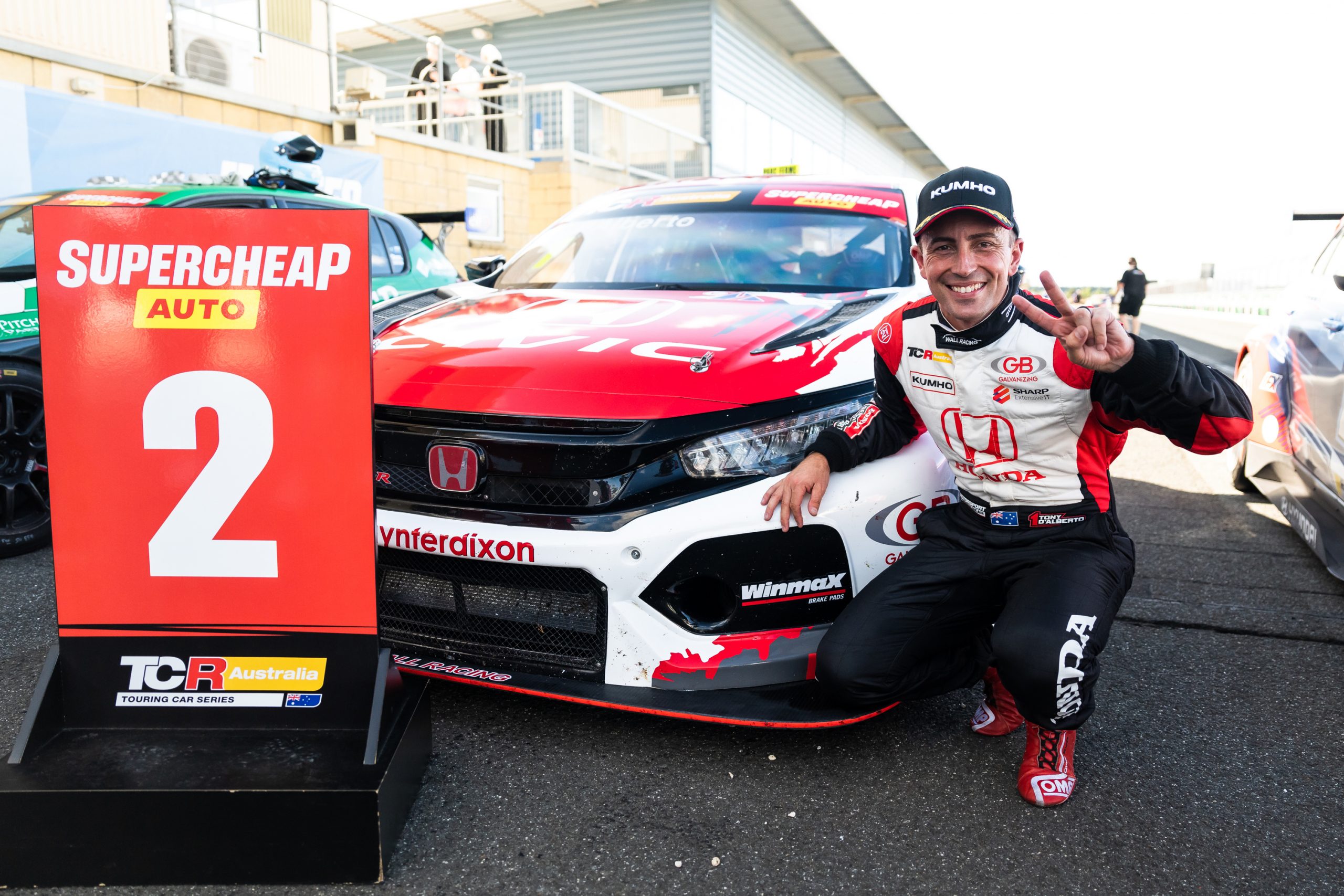 Tony D'Alberto celebrates taking second in race three of the TCR Australia Series at Symmons Plains.