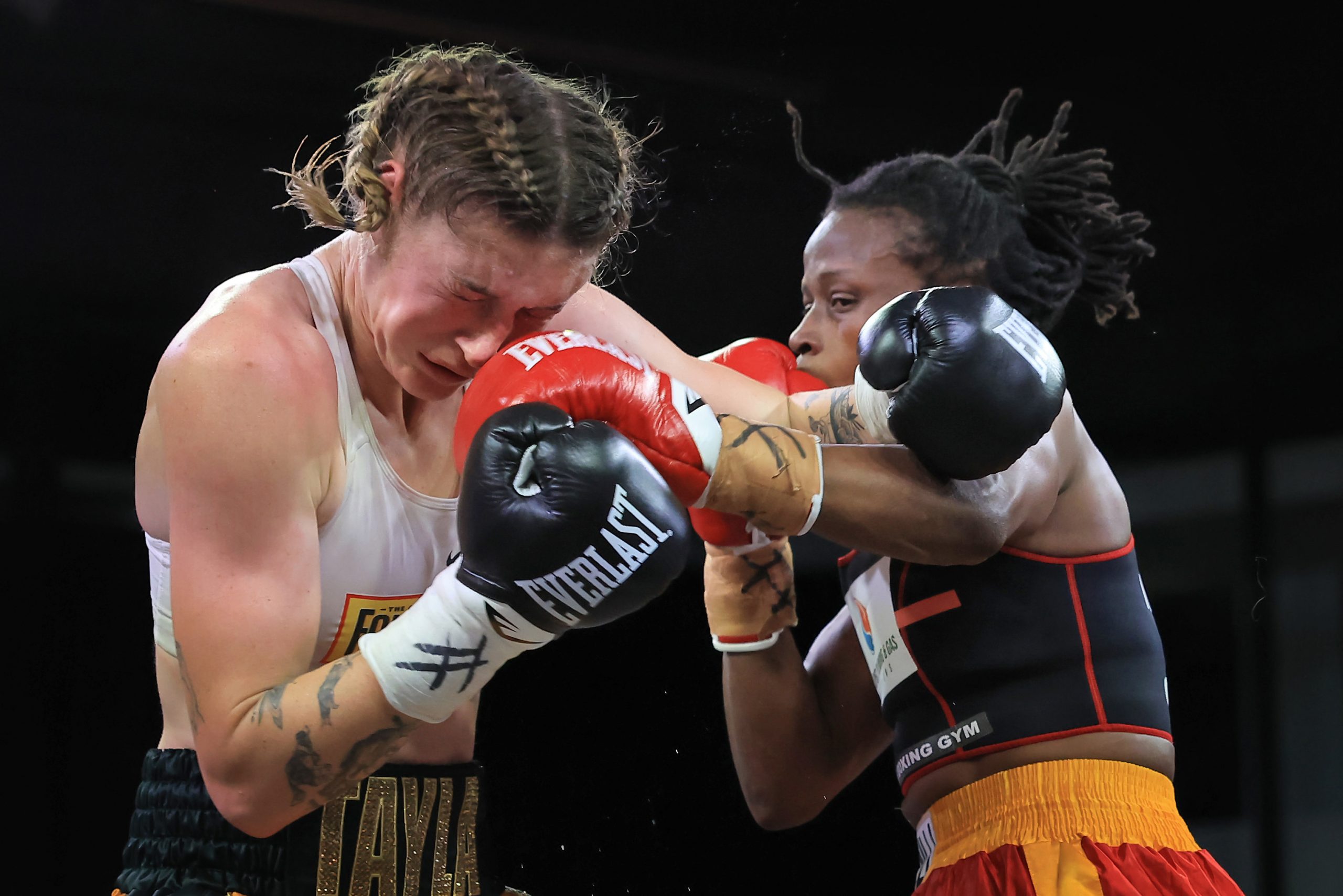 Millicent Agboegbulen throws a punch against Tayla Harris at Hoops Capital East.