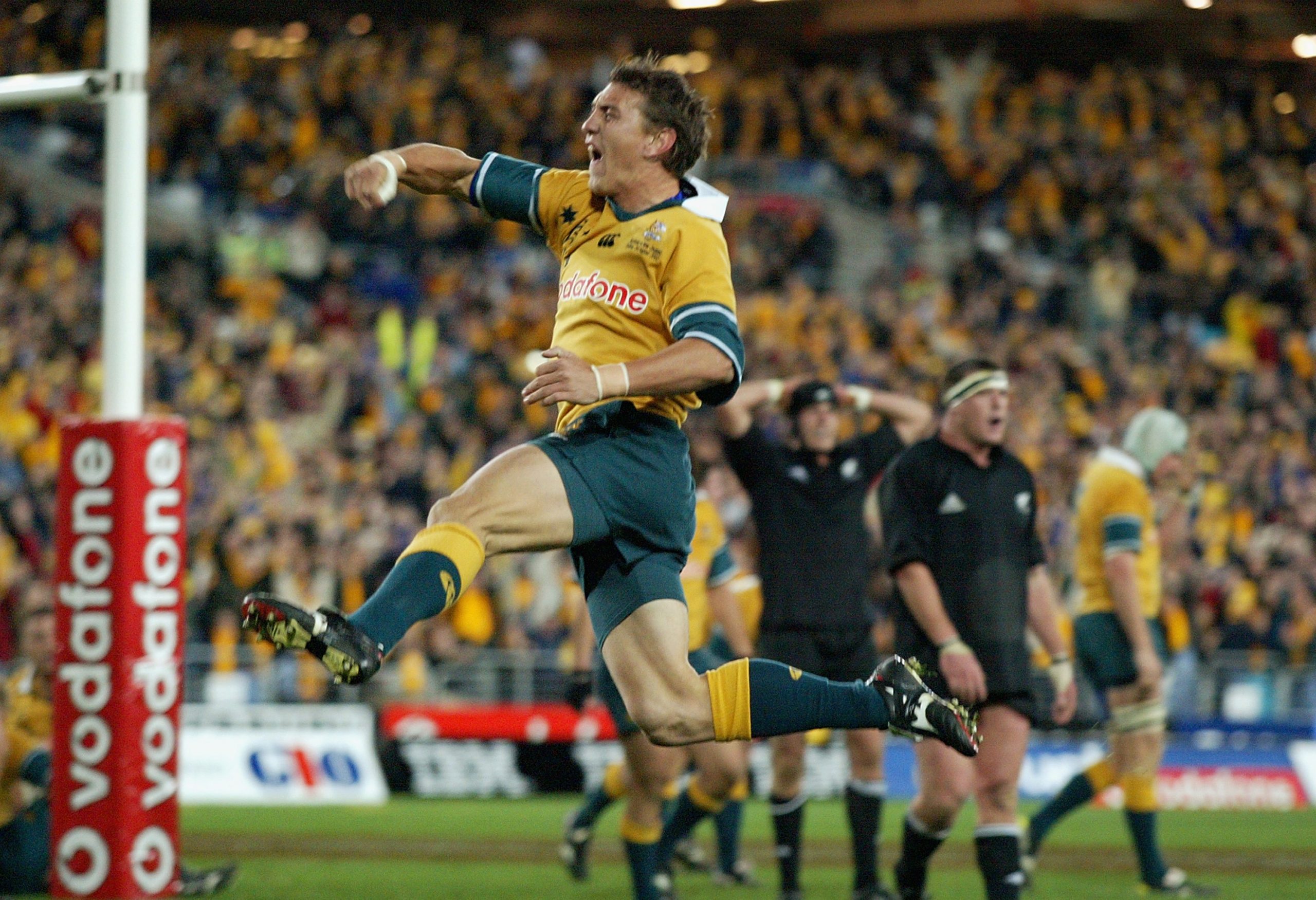Mat Rogers of the Wallabies celebrates scoring a try in 2002.