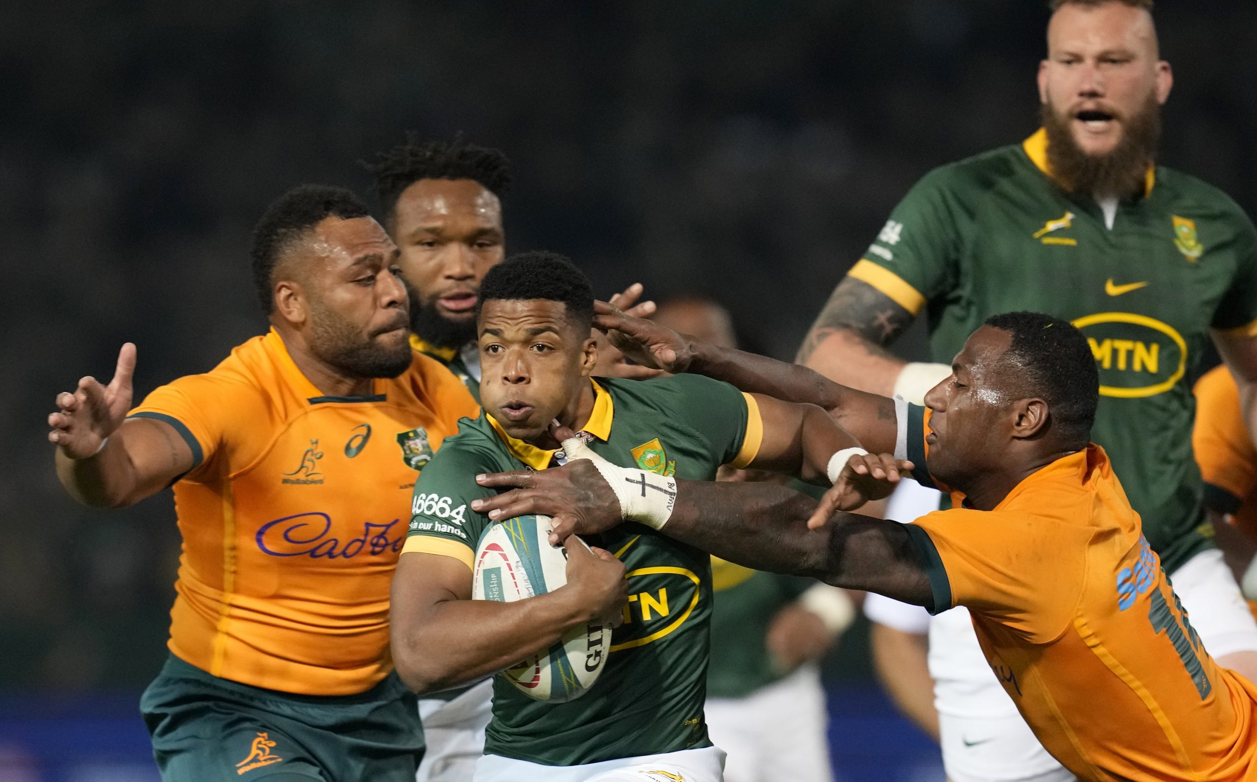 South Africa's Grant Williams avoids a tackle by Australia's Suliasi Vunivalu.