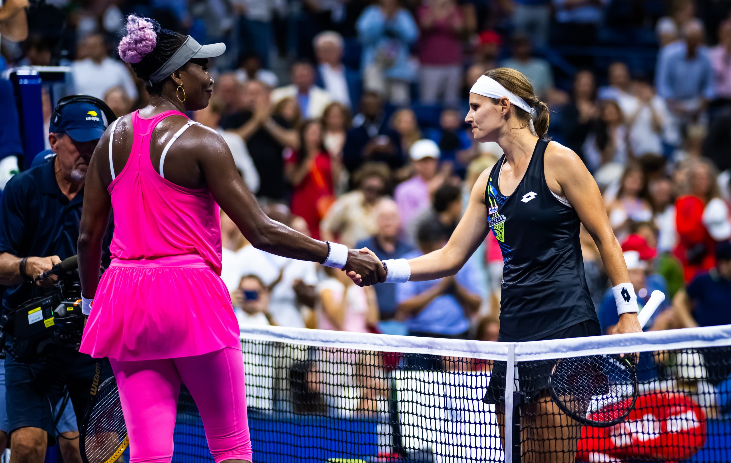 NEW YORK, NEW YORK - AUGUST 29: Venus Williams of the United States and Greet Minne of Belgium shake hands at the net after the first round on Day 2 of the US Open at USTA Billie Jean King National Tennis Center on August 29, 2023 in New York City (Photo by Robert Prange/Getty Images)
