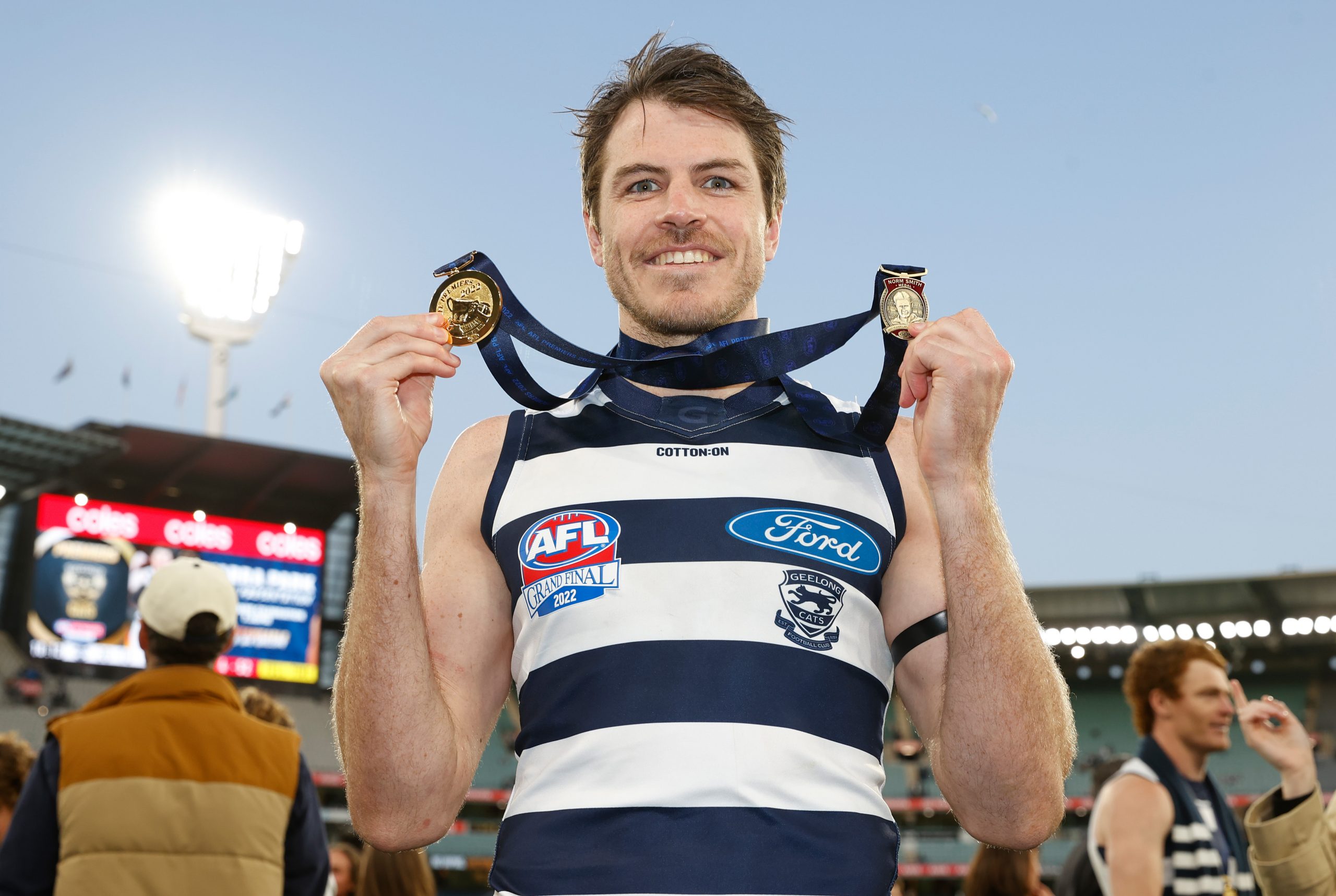 Isaac Smith of the Cats poses with his Norm Smith medal.