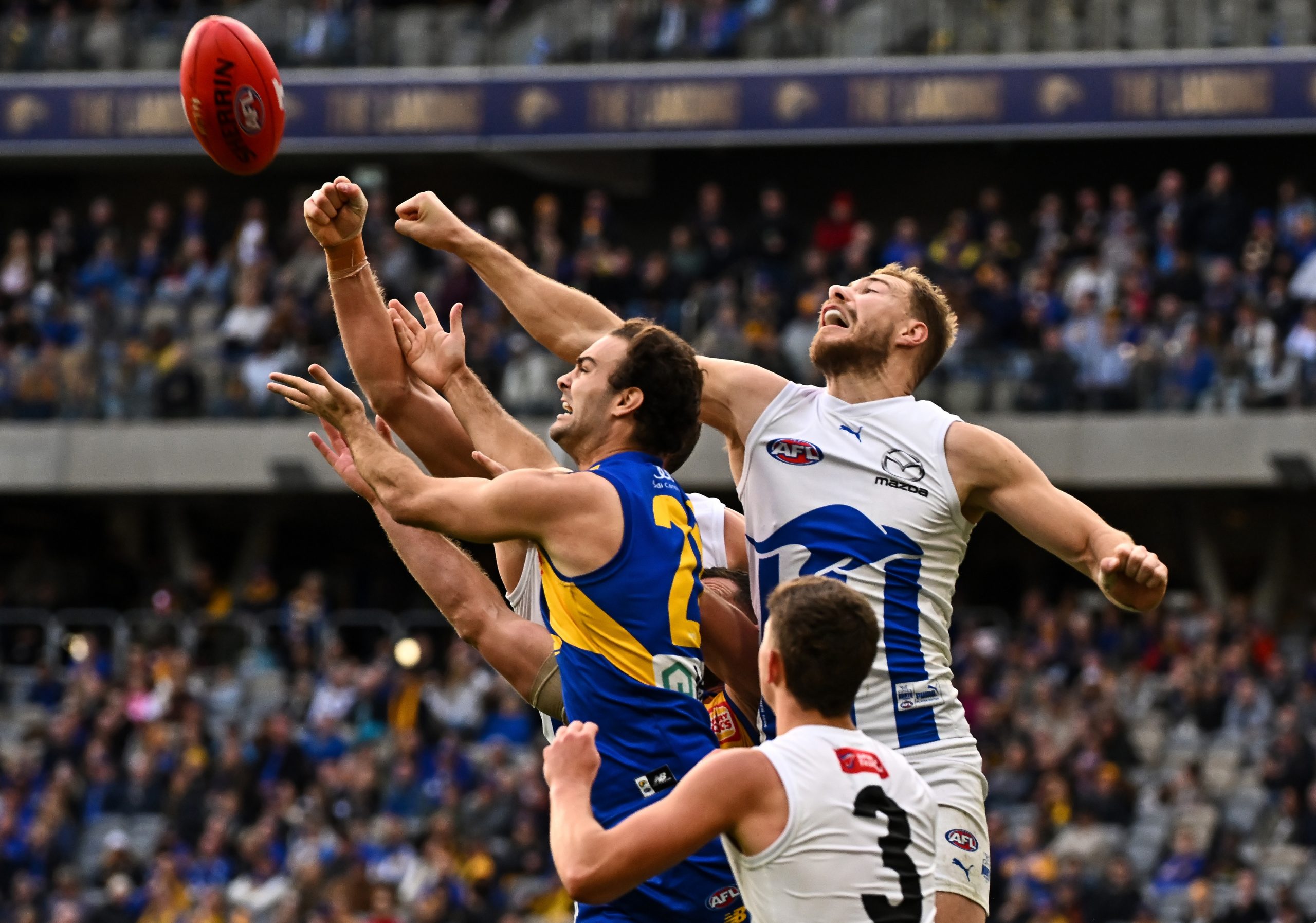 PERTH, AUSTRALIA - JULY 30: Ben McKay of the Kangaroos spoils in a marking contest during the 2023 AFL Round 20 match between the West Coast Eagles and the North Melbourne Kangaroos at Optus Stadium on July 30, 2023 in Perth, Australia. (Photo by Daniel Carson/AFL Photos via Getty Images)