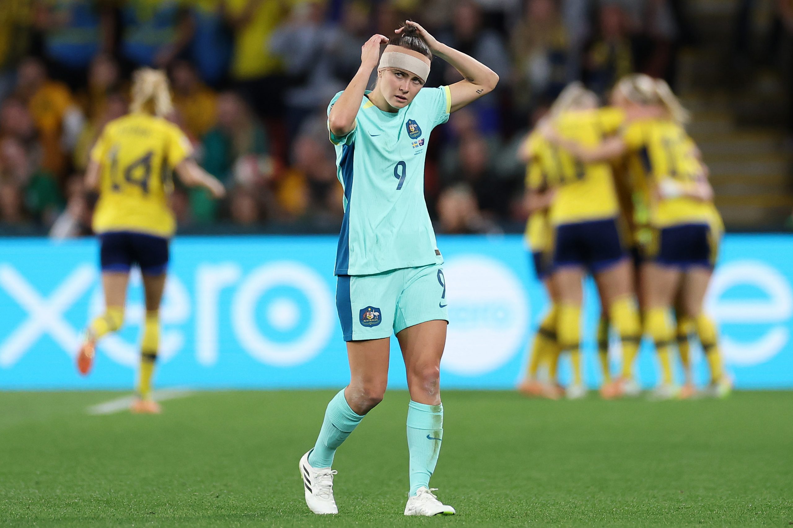 An embattled Caitlin Foord looks on as Kosovare Asllani of Sweden scores.