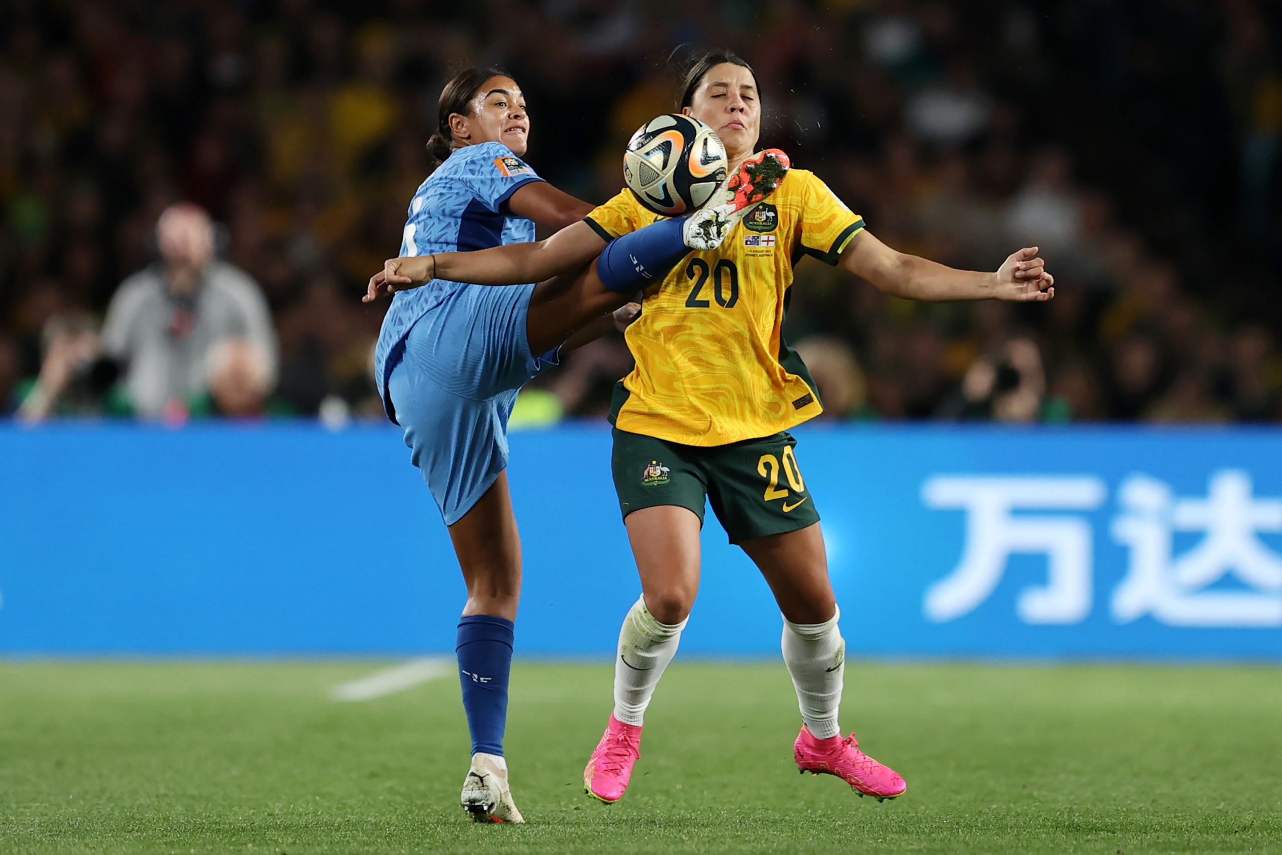 Jessica Carter completes a kung fu kick in the direction of Australia's Sam Kerr.