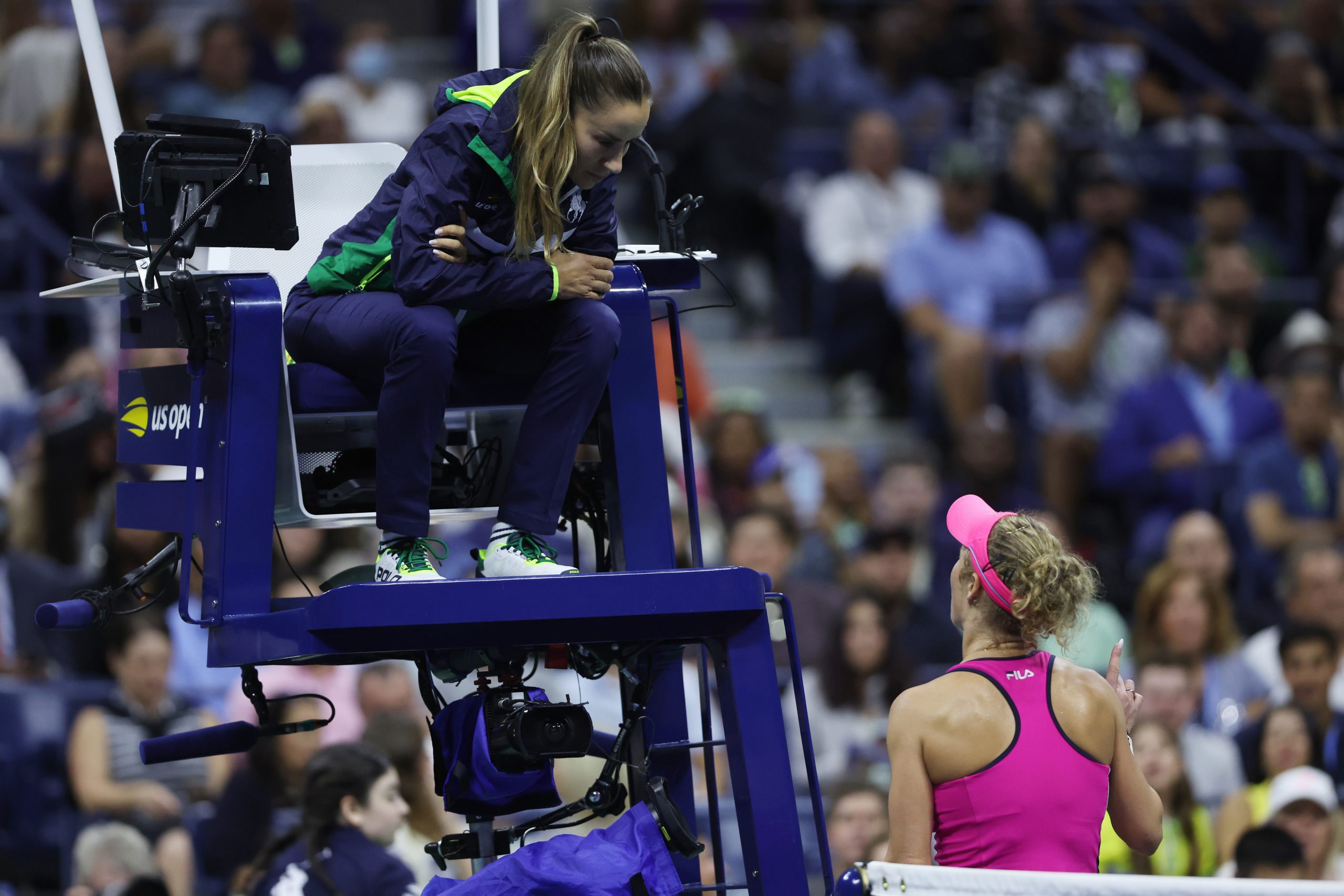 Laura Siegemund speaks to the chair umpire during her loss to Coco Gauff.