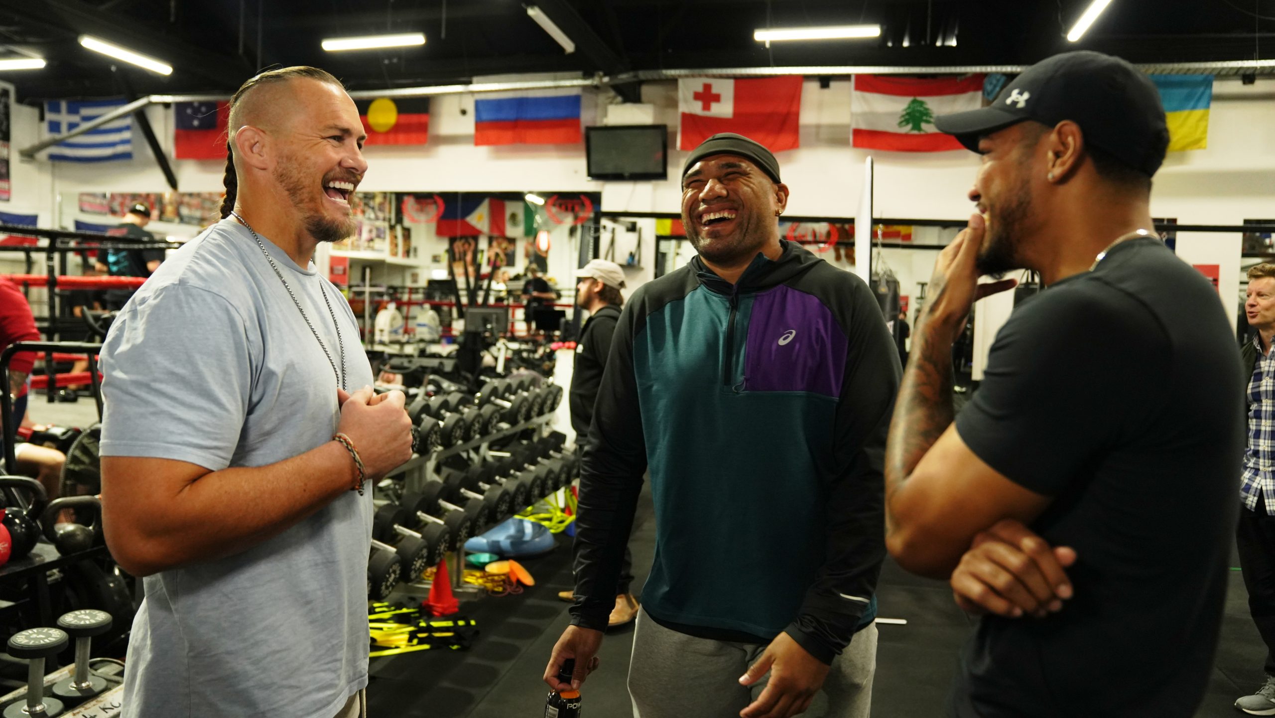 Former Dragons player Matt Cooper (from left) with Eels star Junior Paulo and Paulo Aokuso.