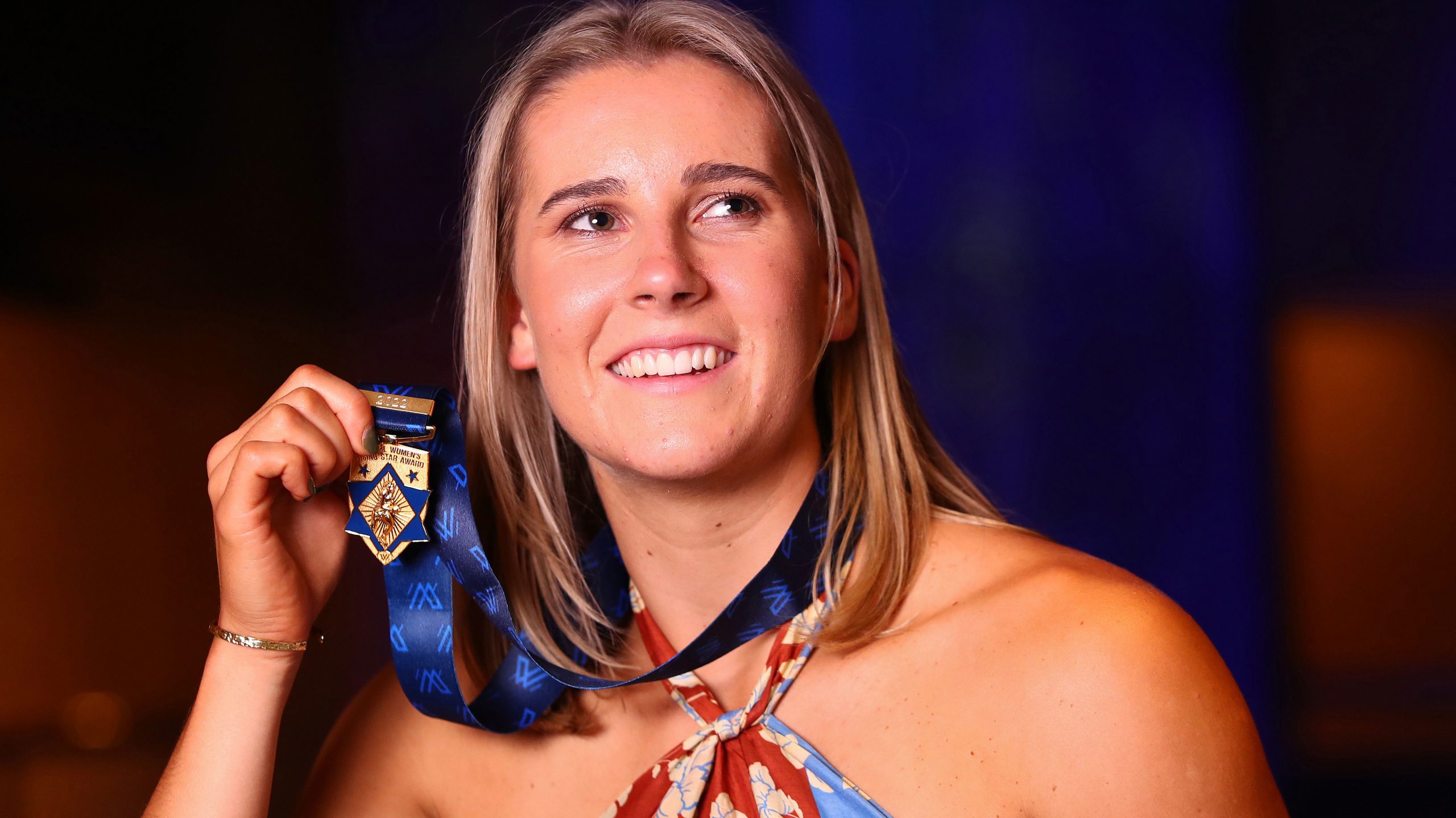 Mimi Hill of the Blues poses for a photo after winning the NAB AFLW Rising Star Award during the 2022 AFLW W Awards. 
