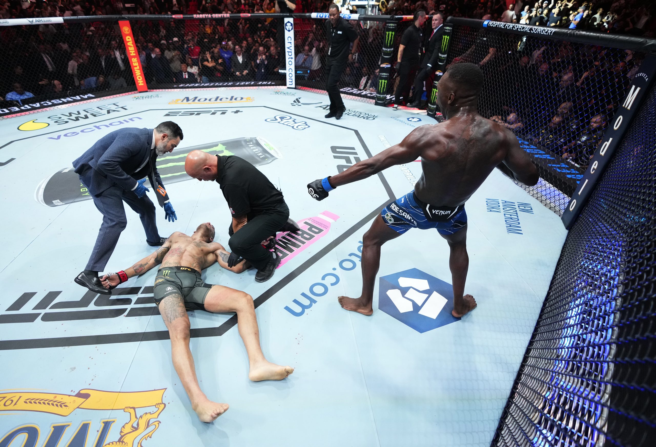 Israel Adesanya reacts after knocking out Alex Pereira in the UFC middleweight championship fight during the UFC 287 event.