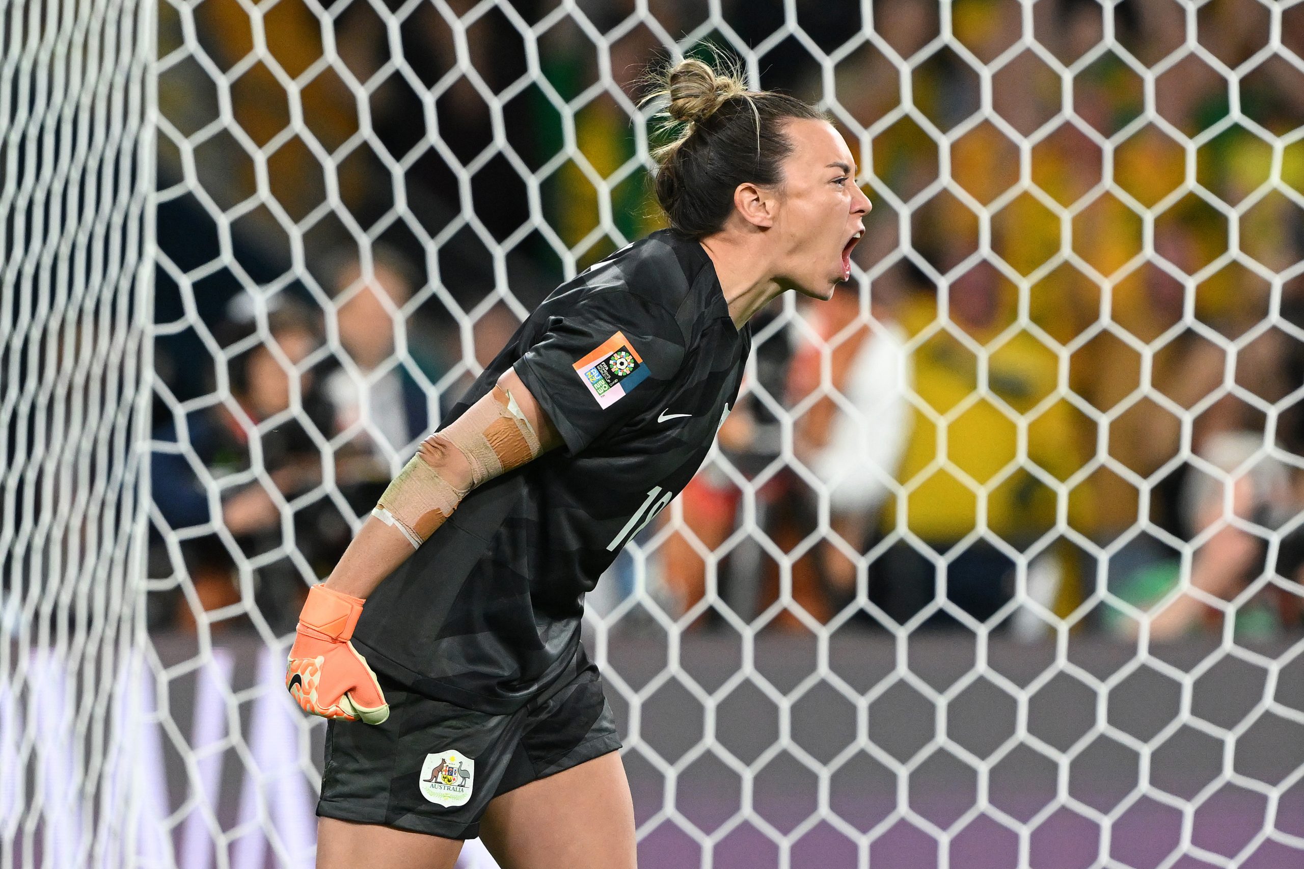 Mackenzie Arnold celebrates after saving the first penalty of France from Selma Bacha.