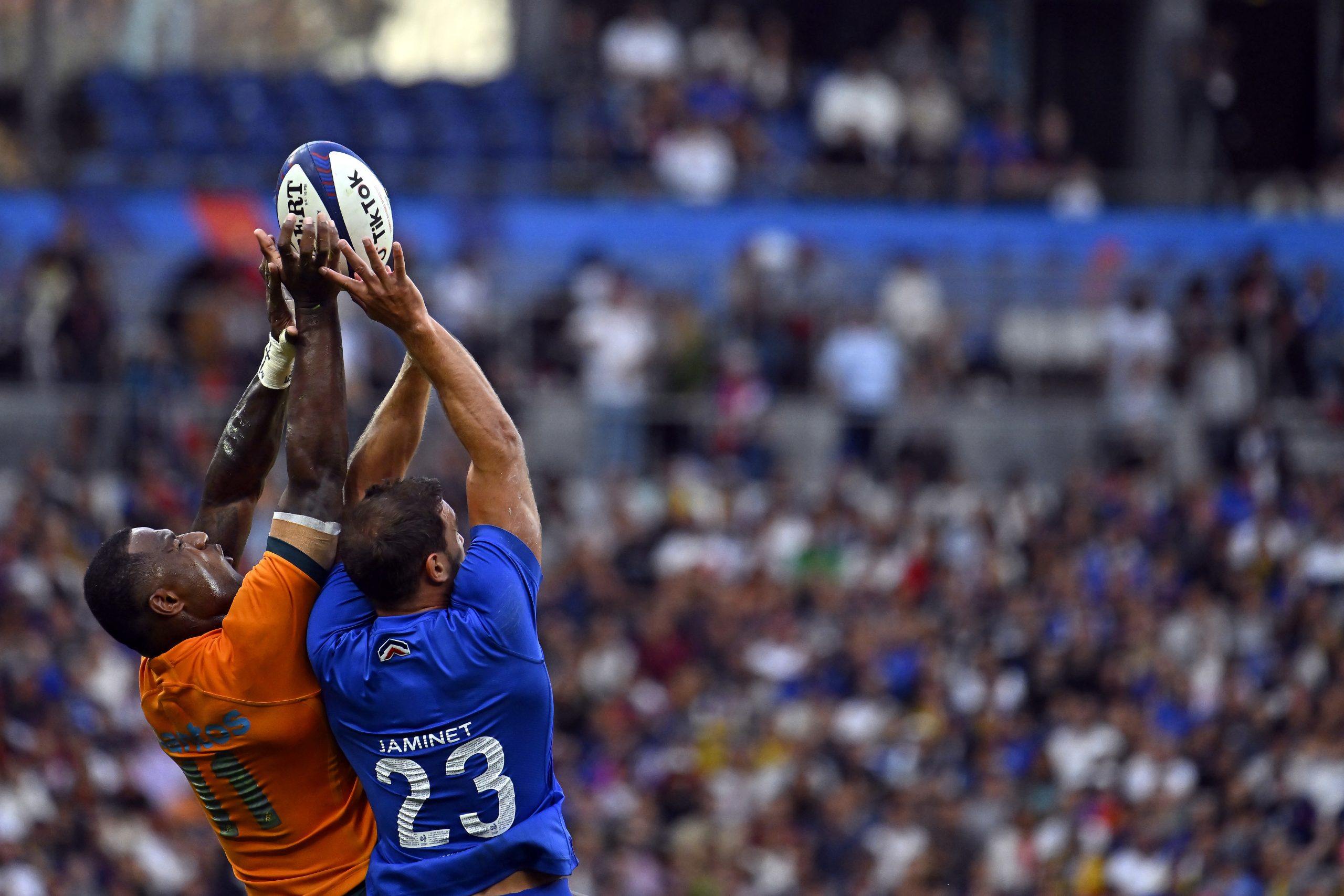 Suliasi Vunivalu of Australia and Melvyn Jaminet of France jump for the ball.