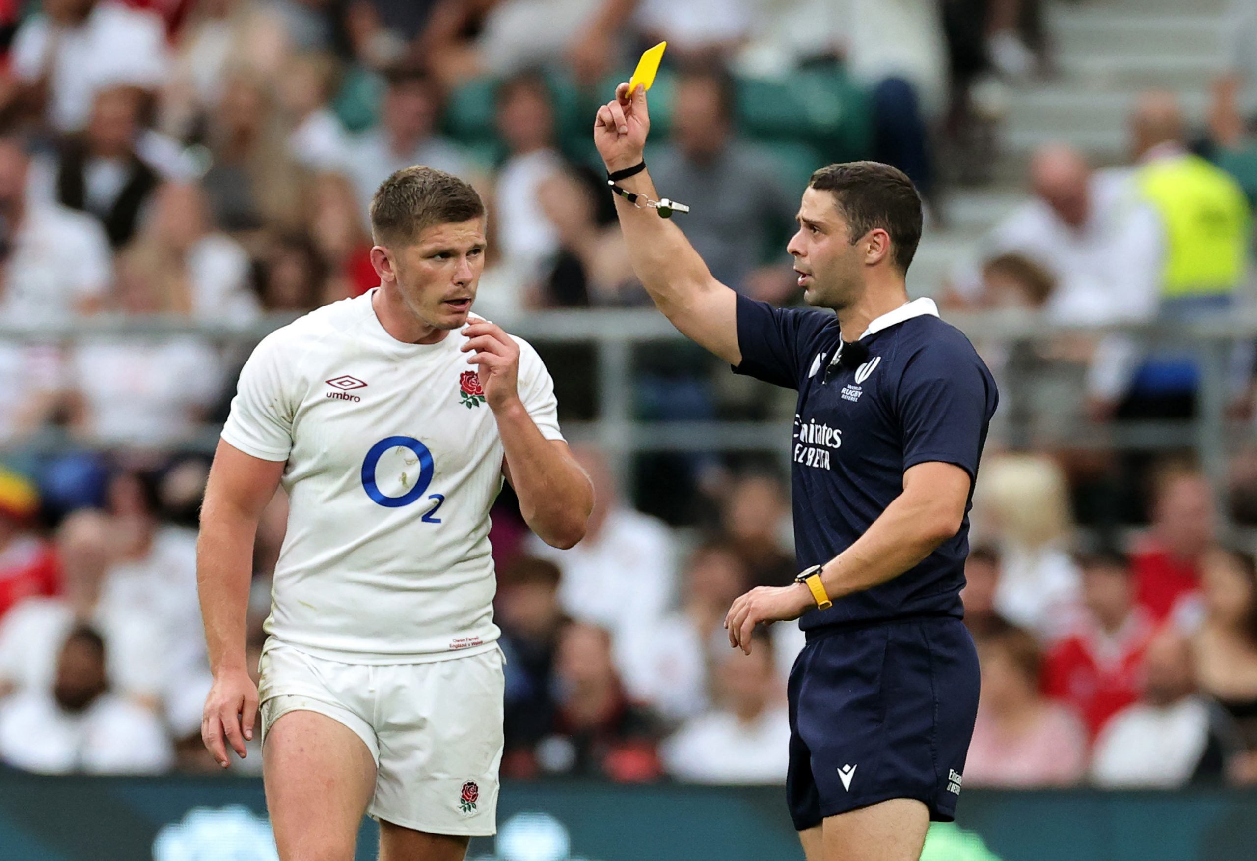 Nika Amashukeli, the referee, shows Owen Farrell a yellow card which was later upgraded to red after a TMO review.